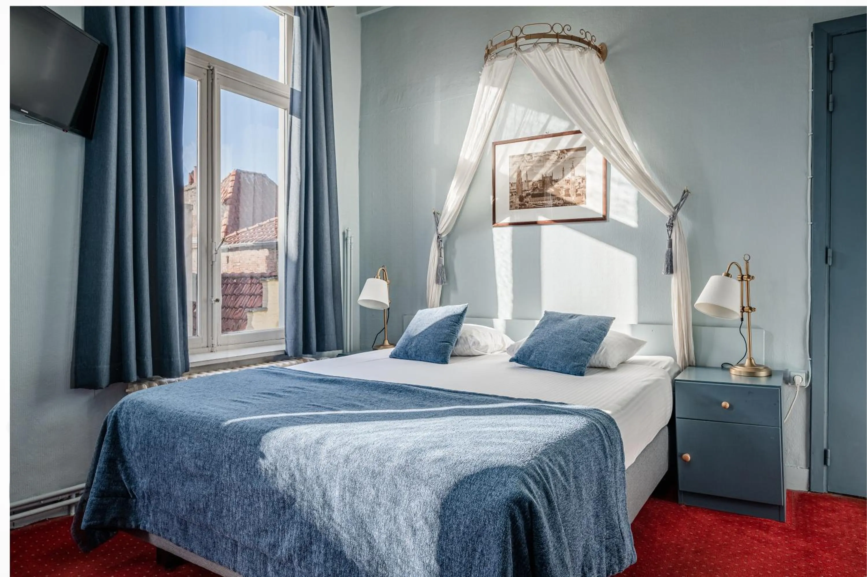 Bed in Hotel Van Eyck