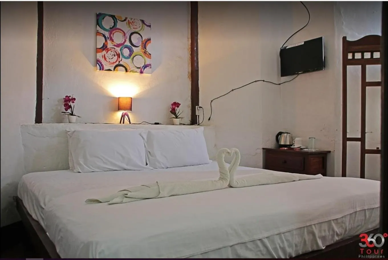 Bed in Escolta's Homey Lodge