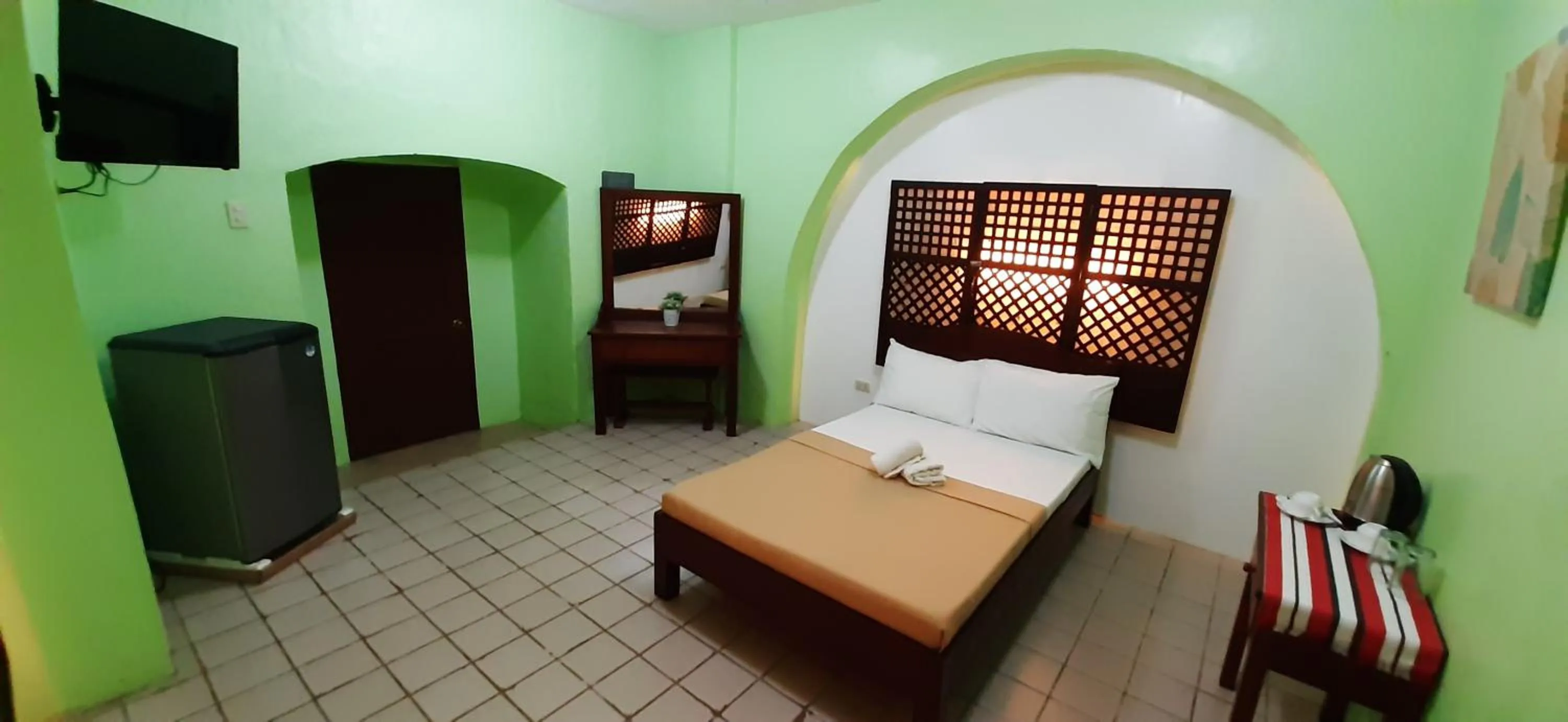 Bed in Escolta's Homey Lodge