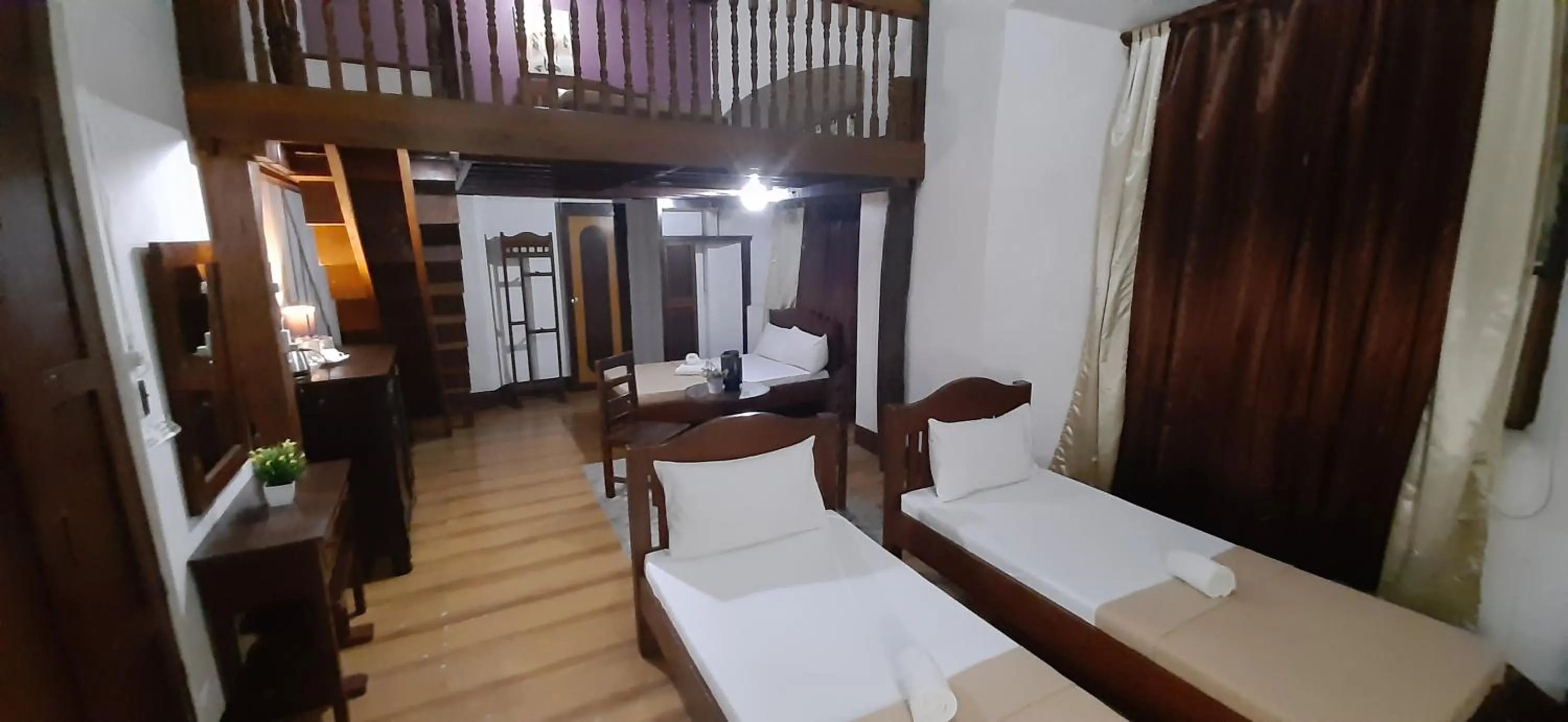 Bed in Escolta's Homey Lodge