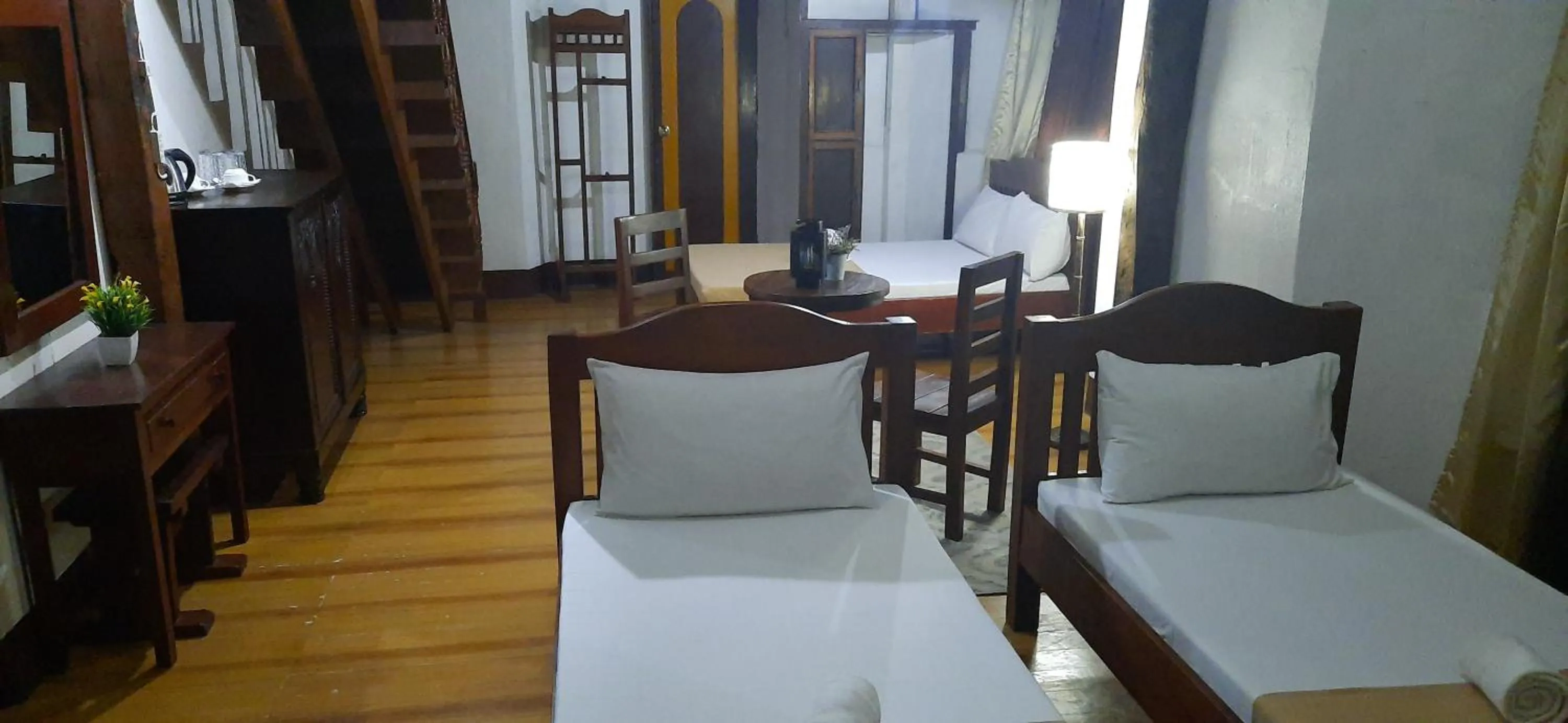 Bed in Escolta's Homey Lodge