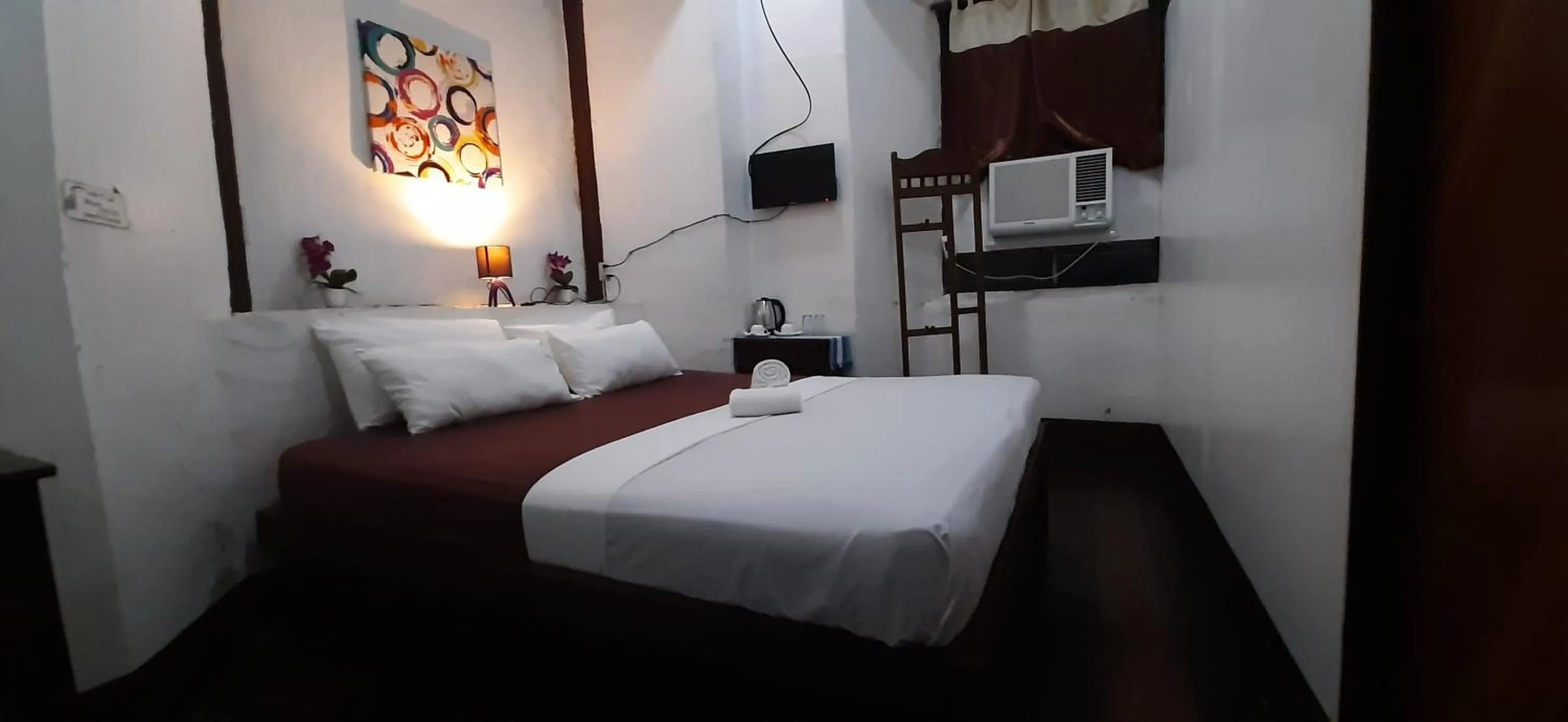 Bed in Escolta's Homey Lodge