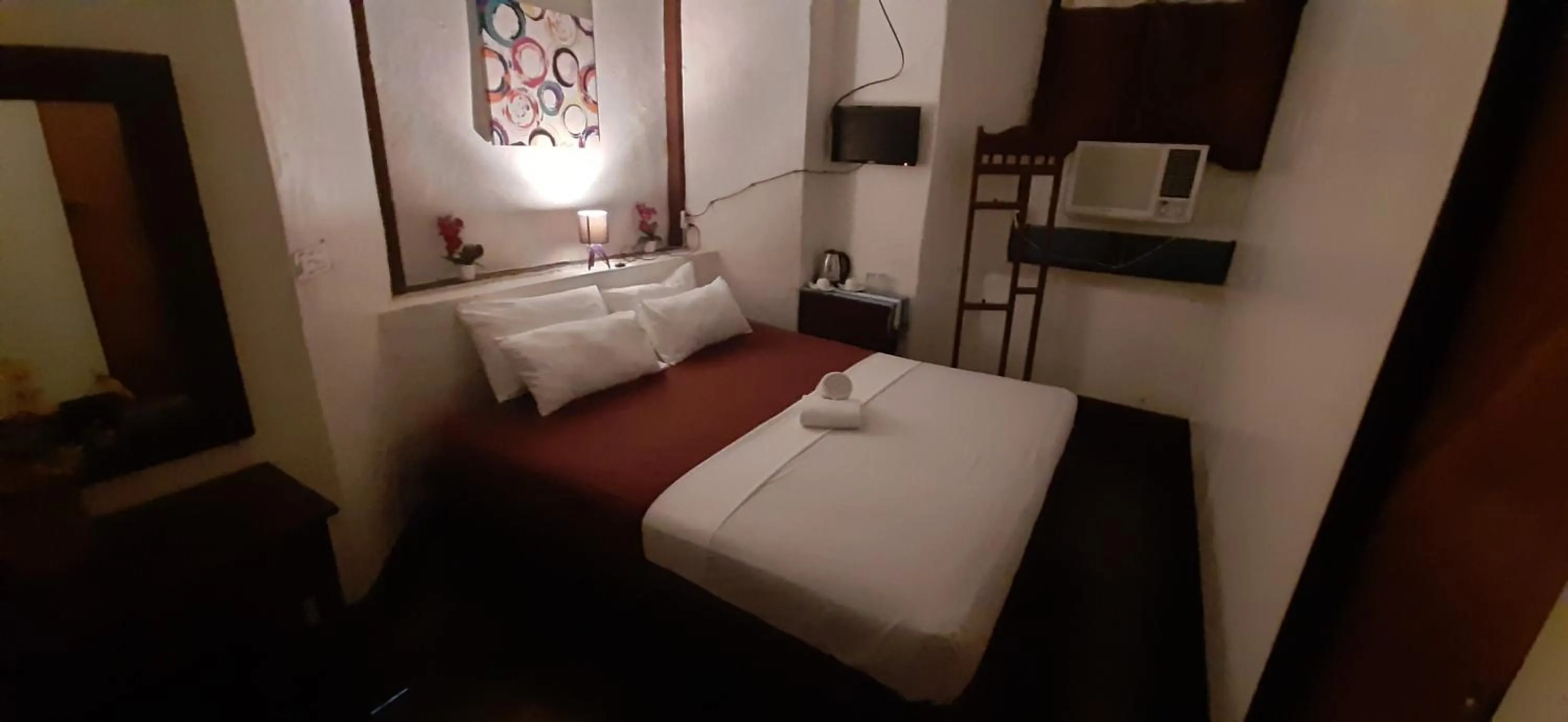 Bed in Escolta's Homey Lodge