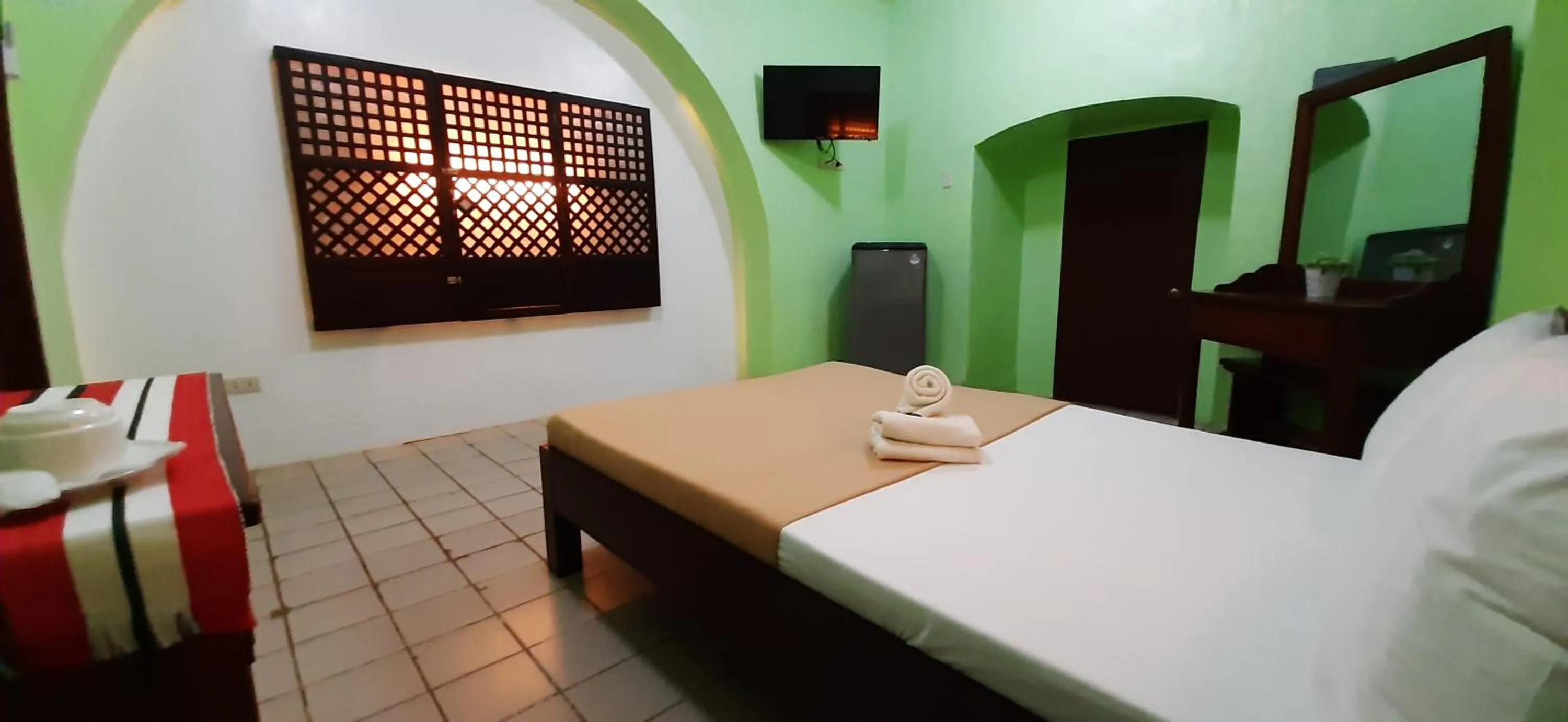 Bed in Escolta's Homey Lodge