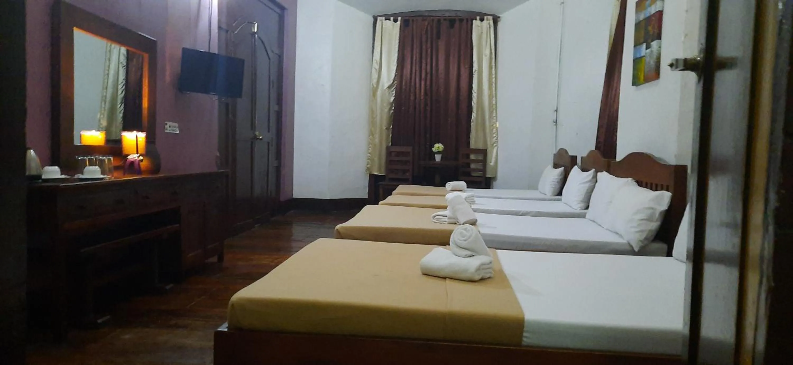 Bed in Escolta's Homey Lodge