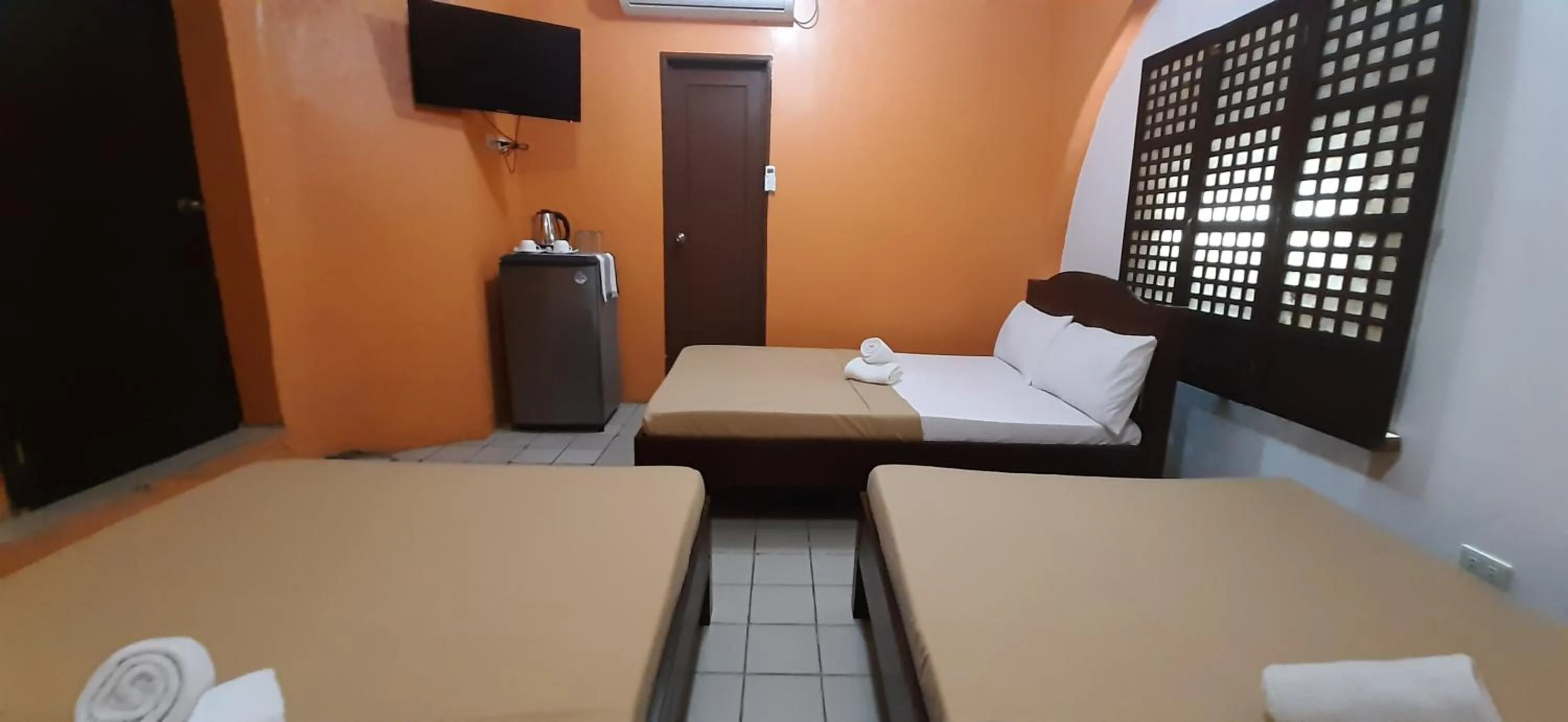 Bed in Escolta's Homey Lodge