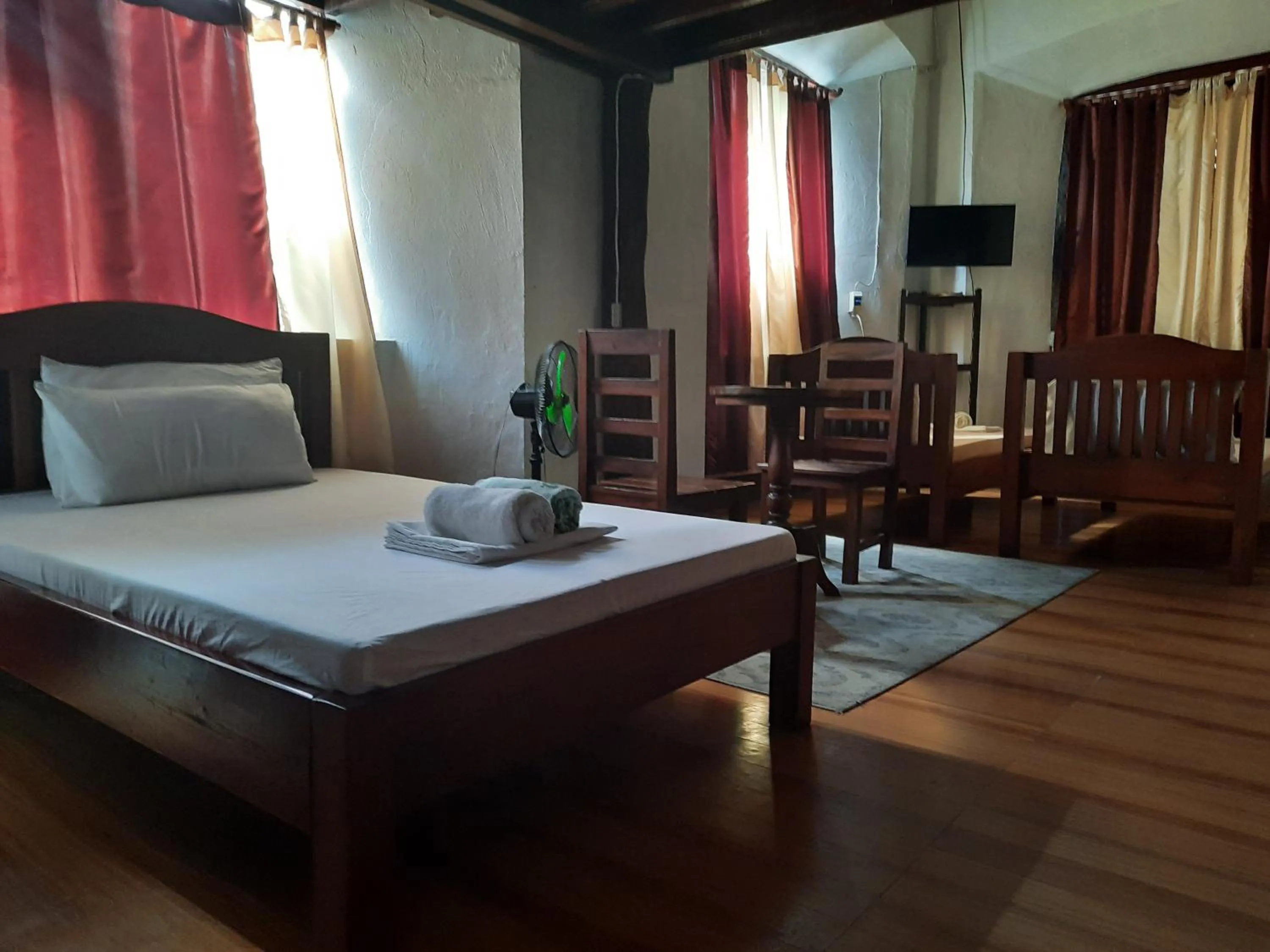 Bed in Escolta's Homey Lodge