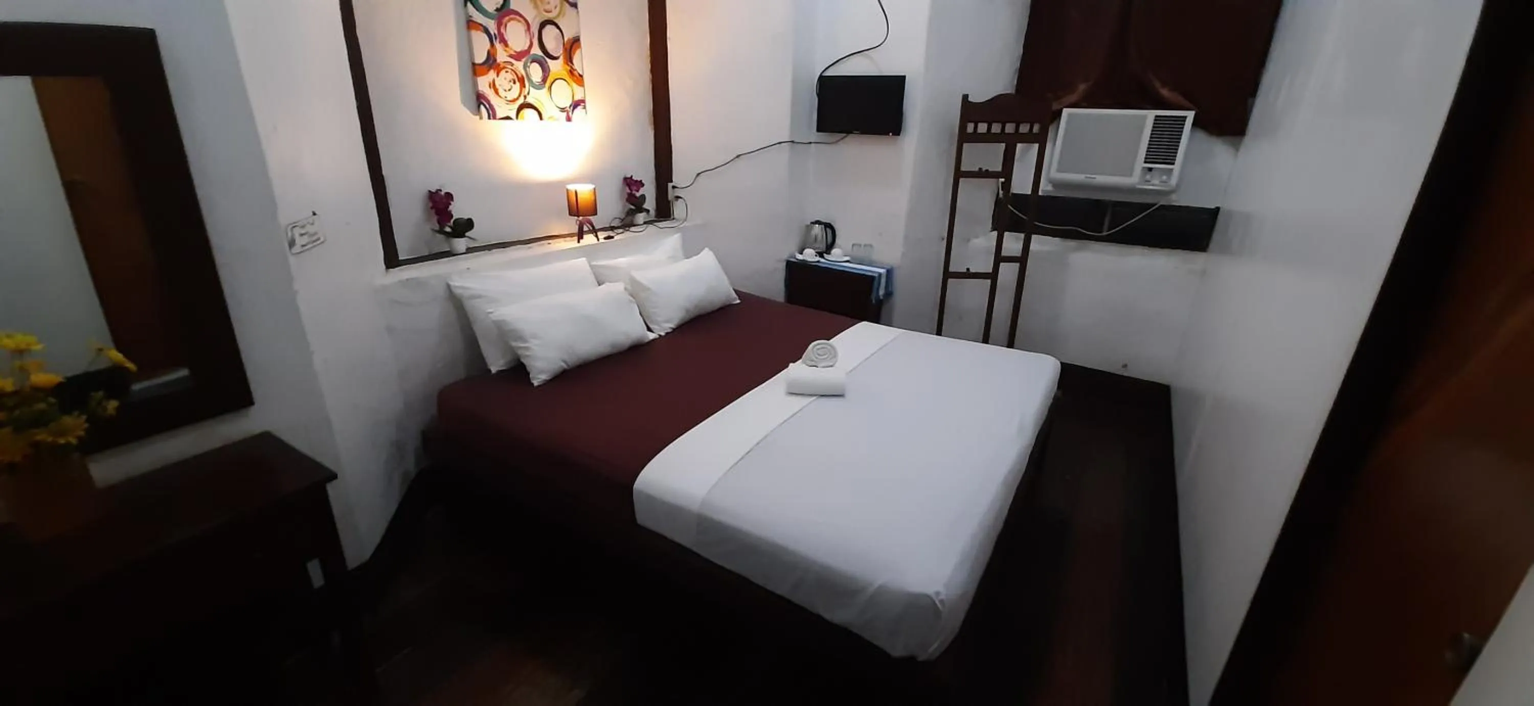 Bed in Escolta's Homey Lodge