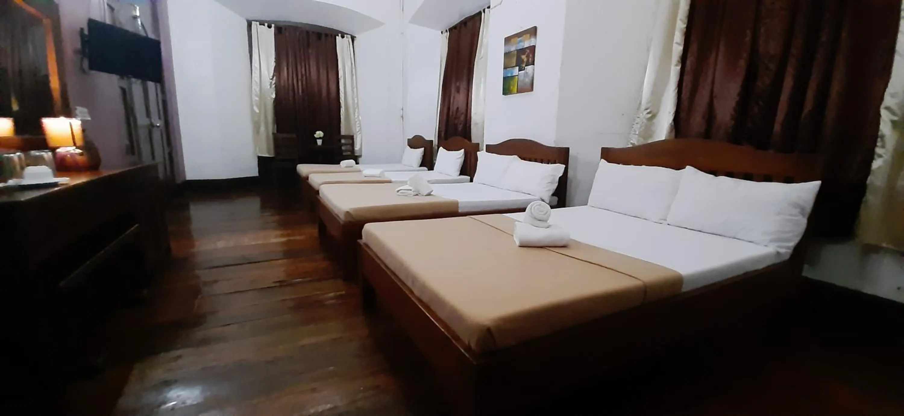 Bed in Escolta's Homey Lodge