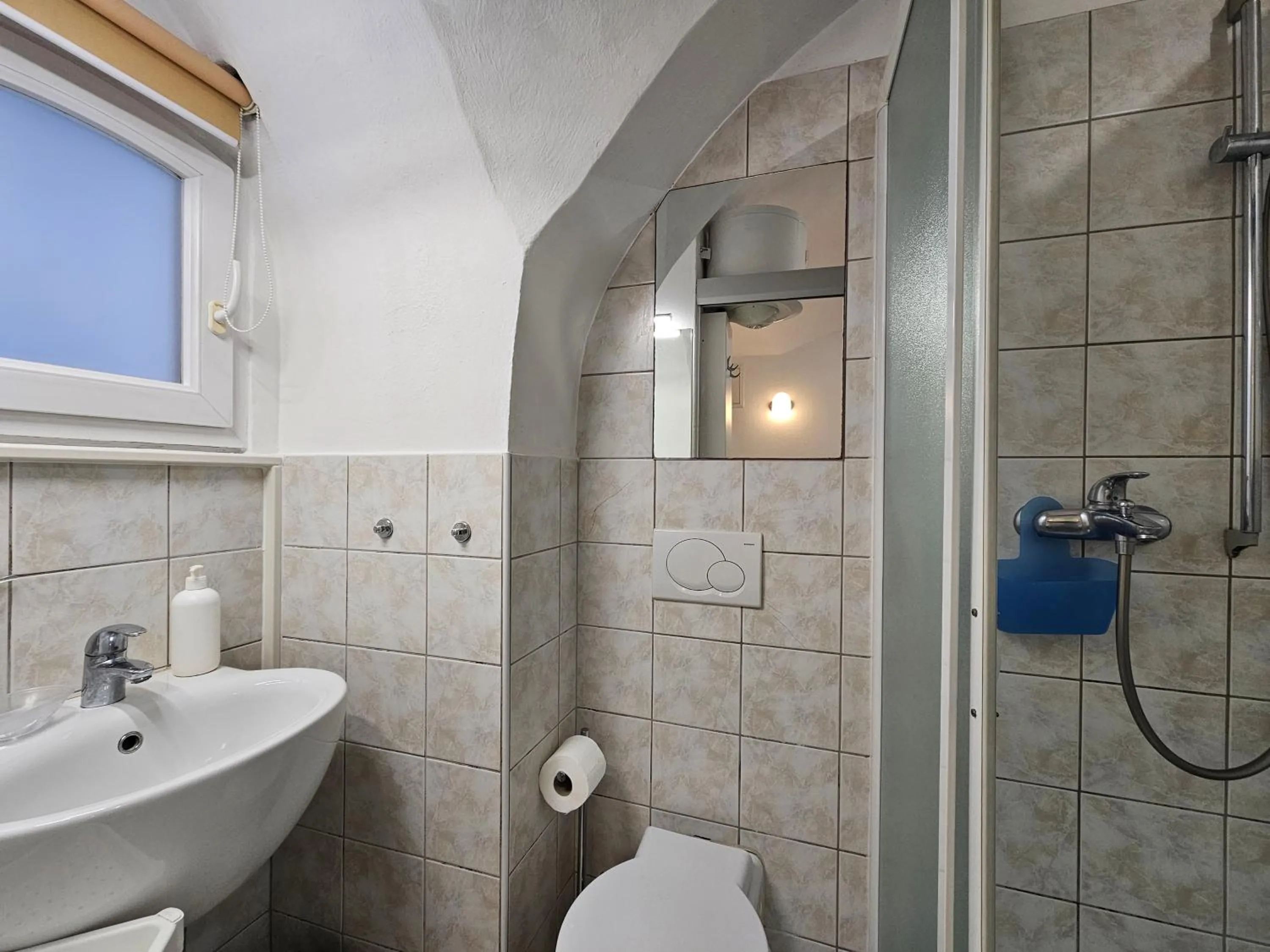 Shower in Tiny central studio apartment Nika Ljubljana