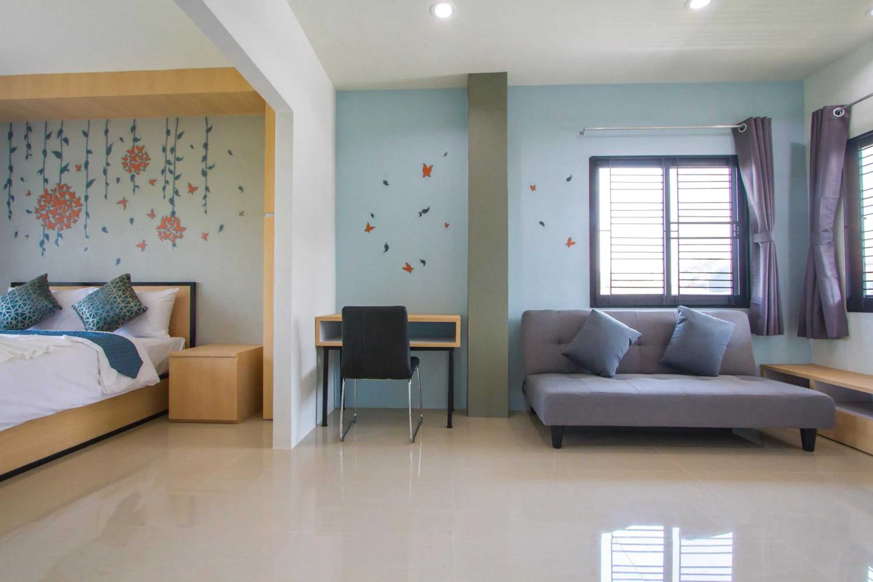 Living room, Bed in Sirimunta Hotel Chiang Rai Suite & Residence