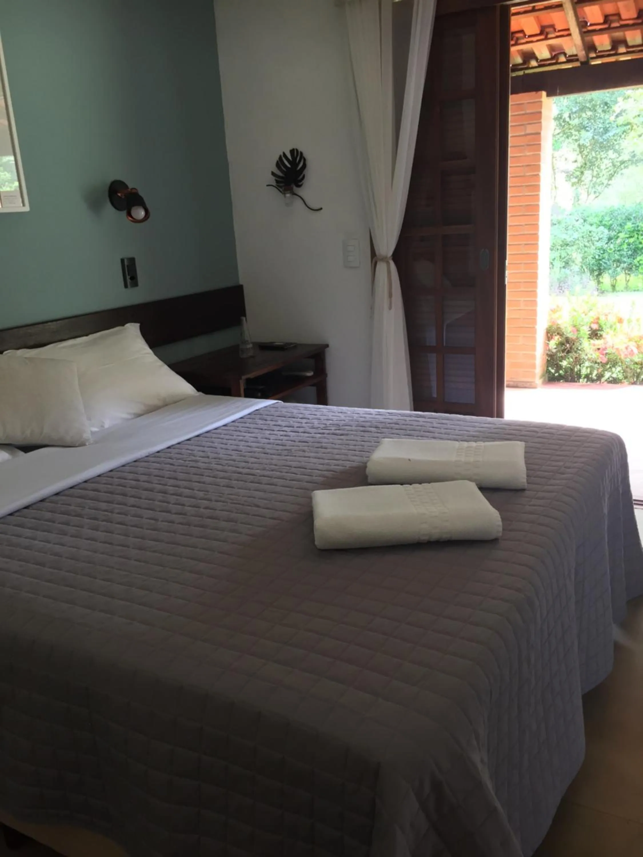 Bed in Pousada Quintal da Prosa