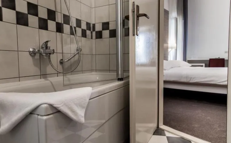 Bathroom, Bed in Slavija Culture Heritage Hotel
