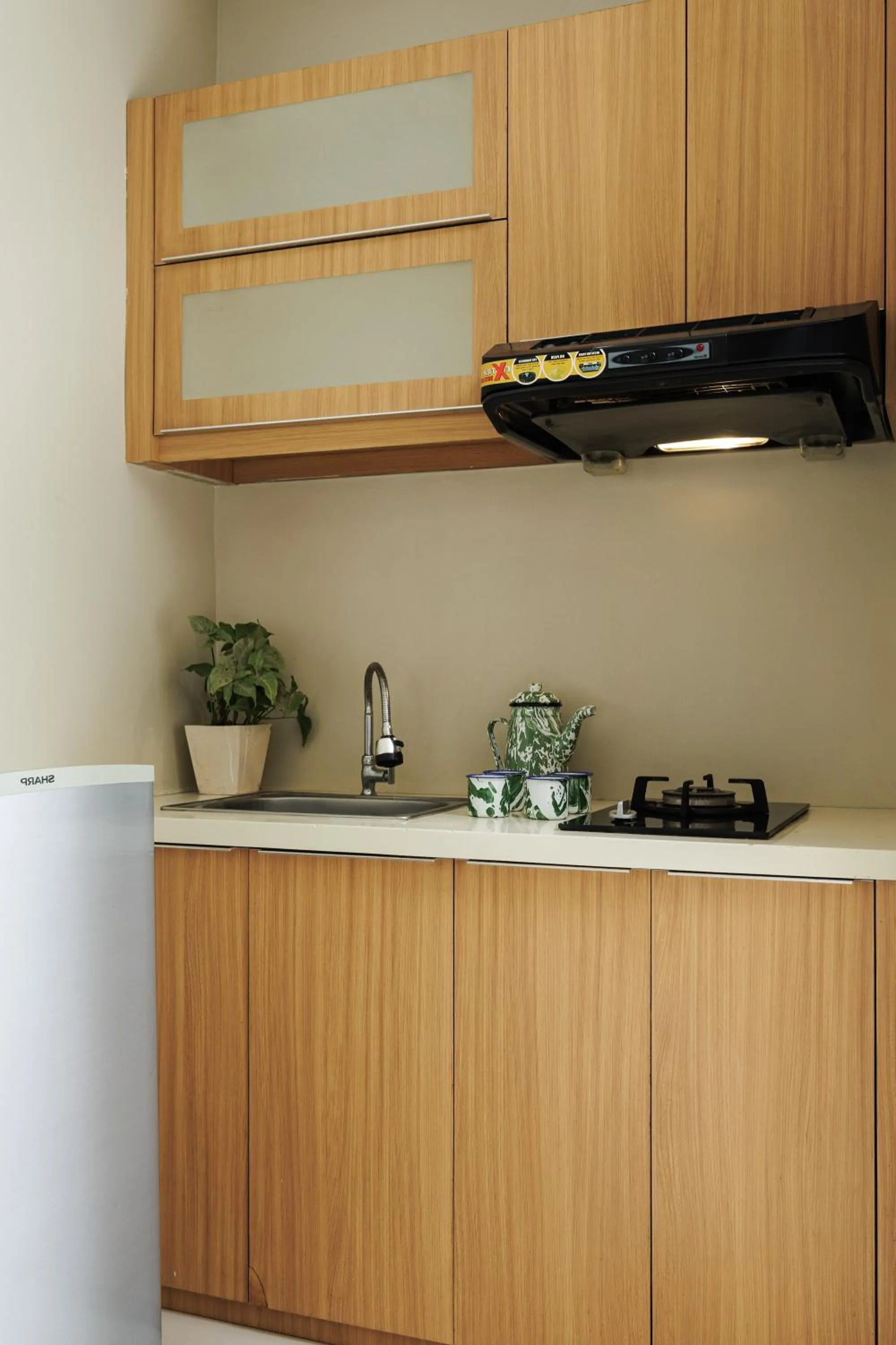 Kitchen or kitchenette in Deva Bali Apartement