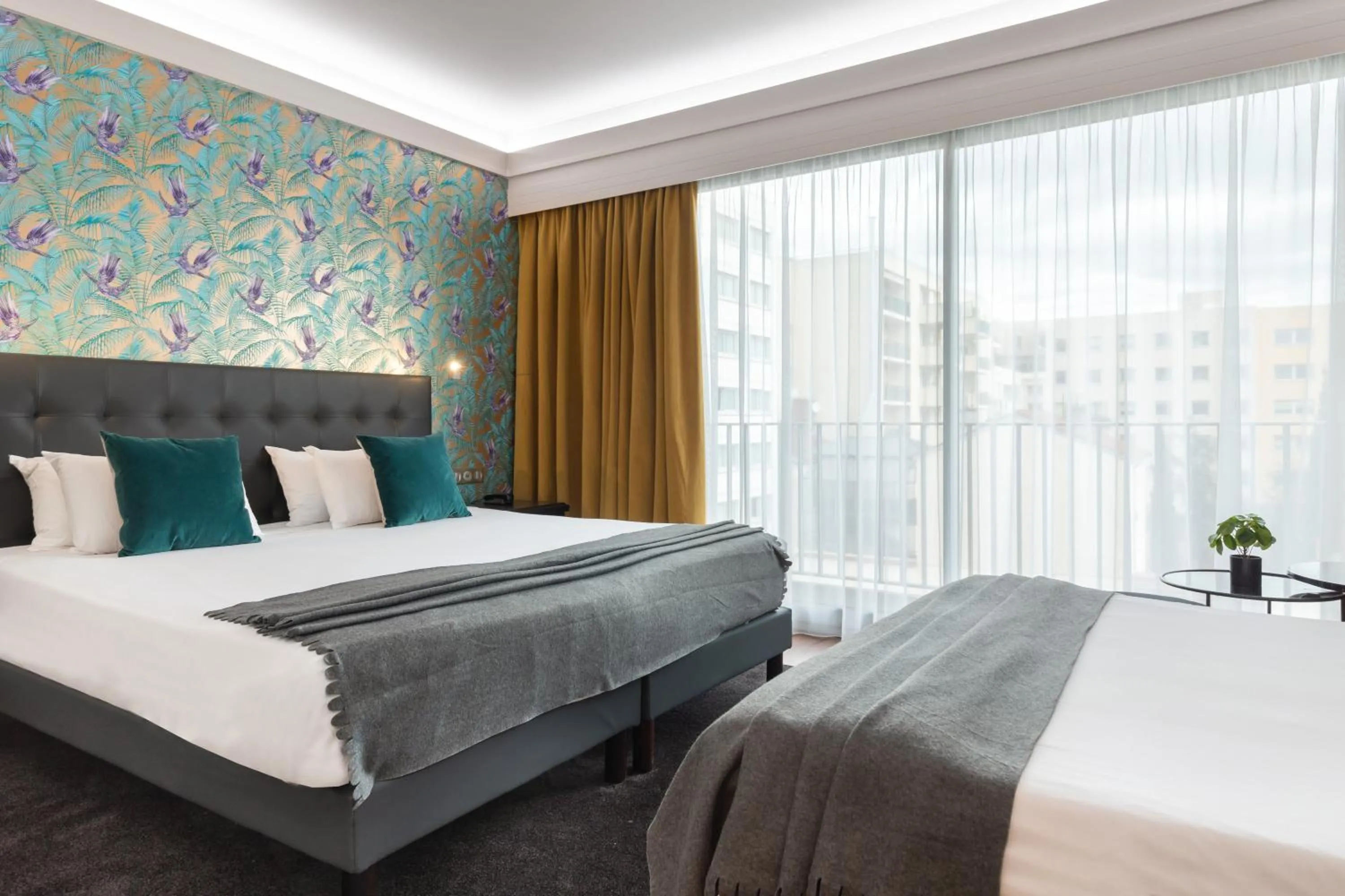 Bed in Hôtel Charlemagne by Happyculture