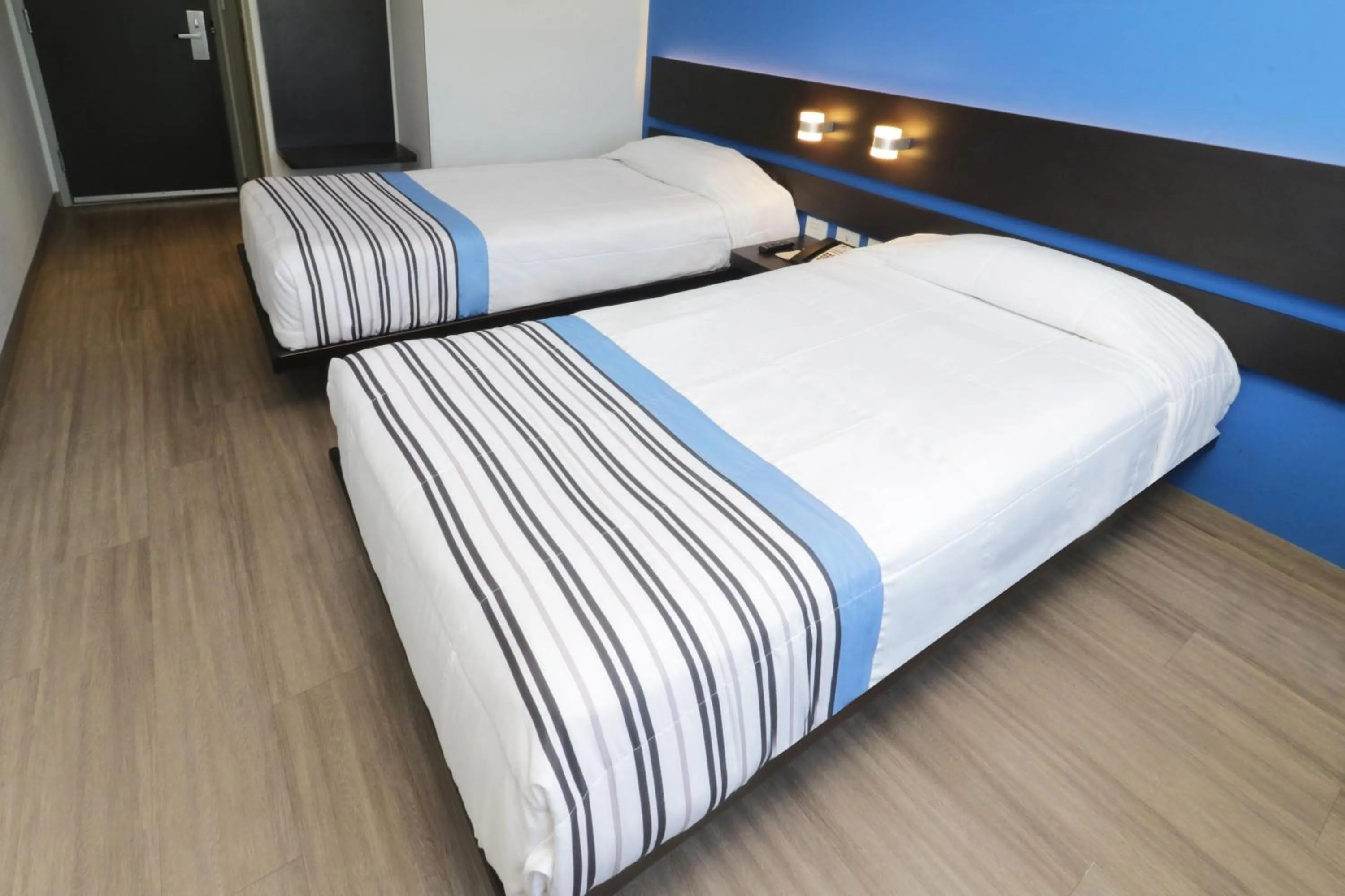 Bedroom, Bed in City Express Junior by Marriott Merida Altabrisa