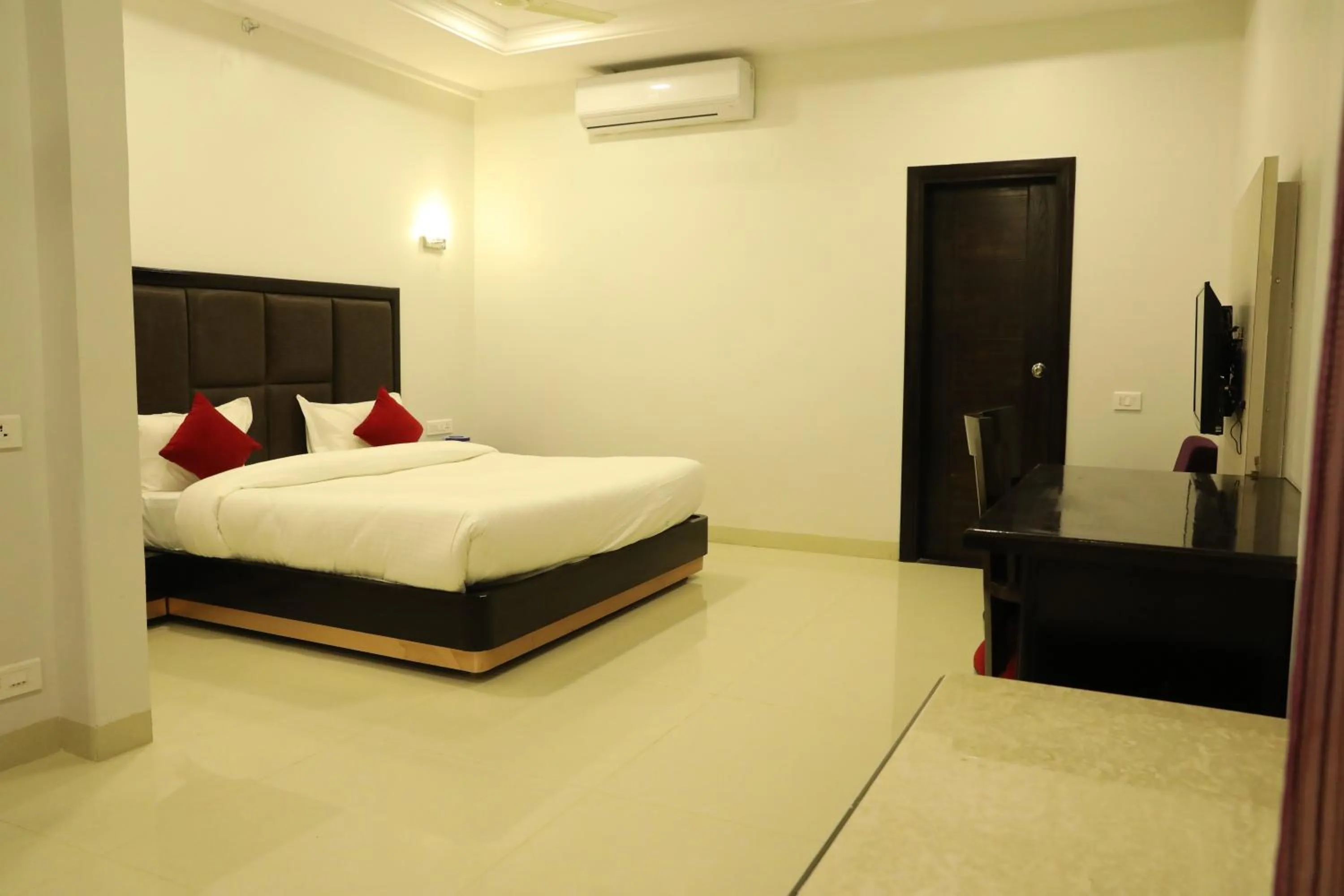 Photo of the whole room, Bed in Chandra Grand