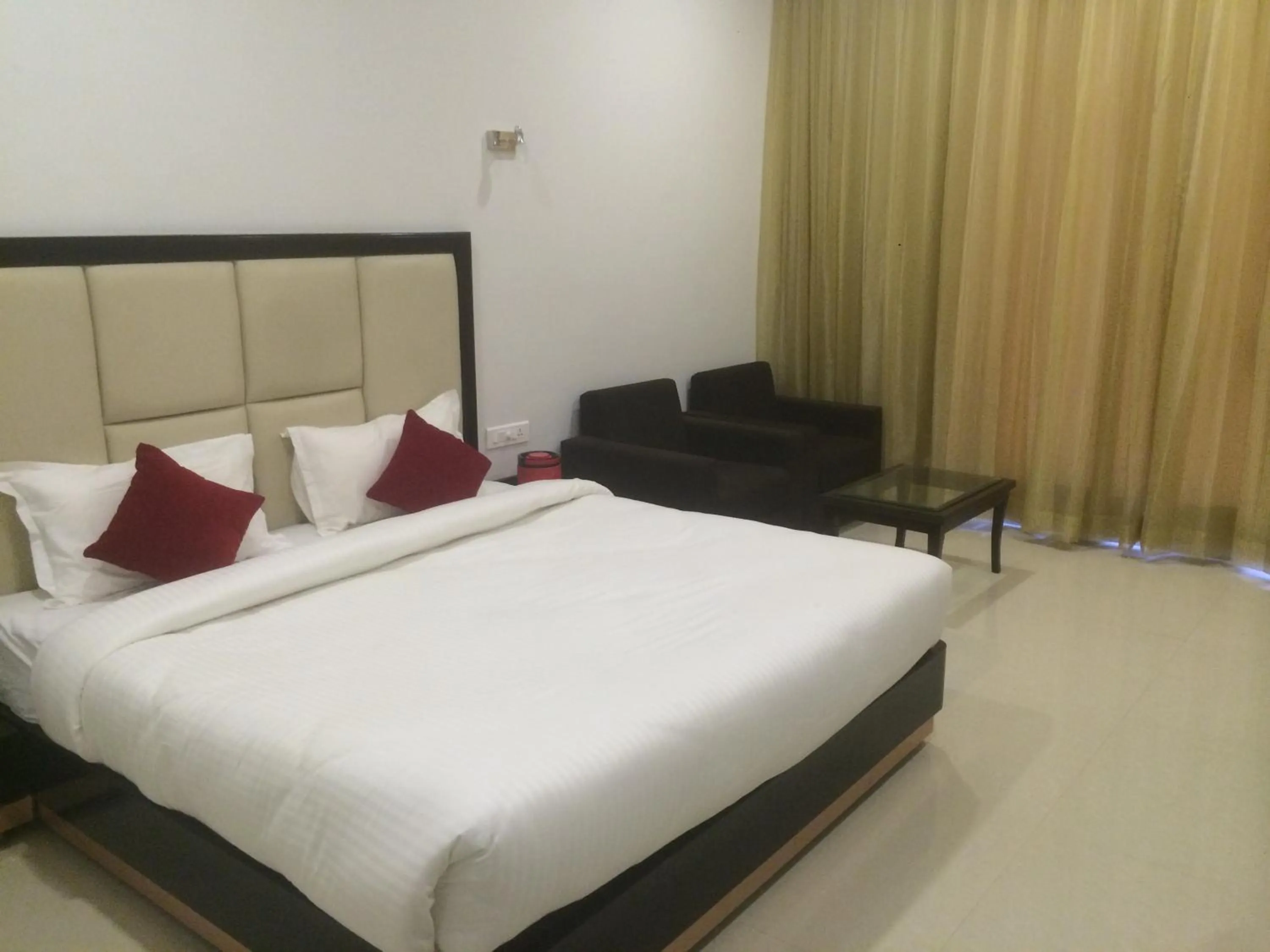 Photo of the whole room, Bed in Chandra Grand