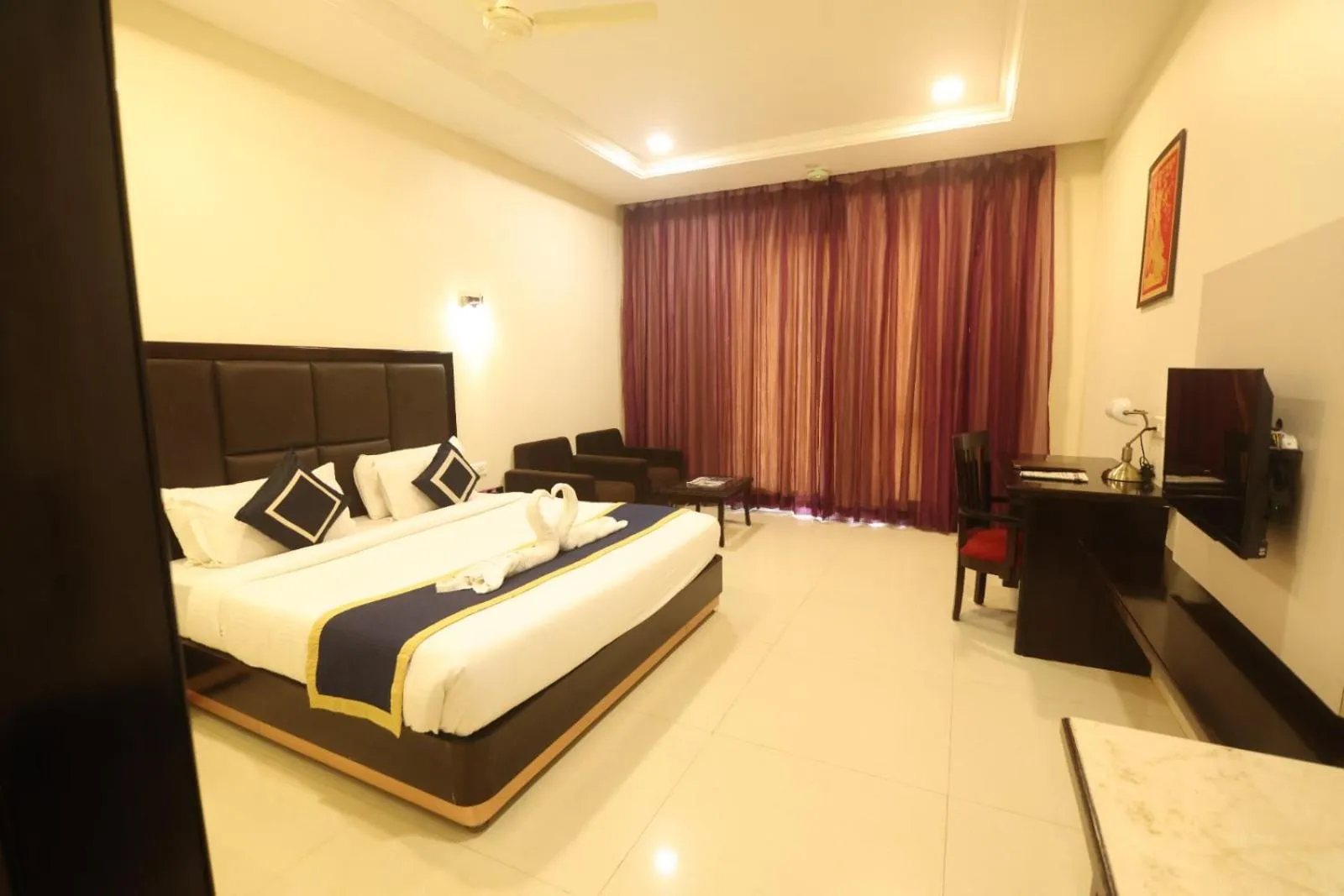 Photo of the whole room, Bed in Chandra Grand