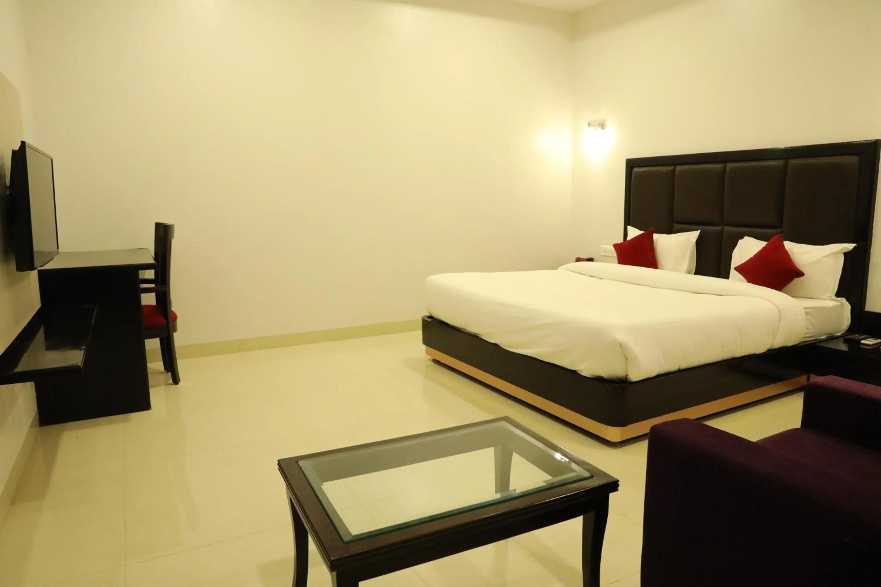 Photo of the whole room, Bed in Chandra Grand