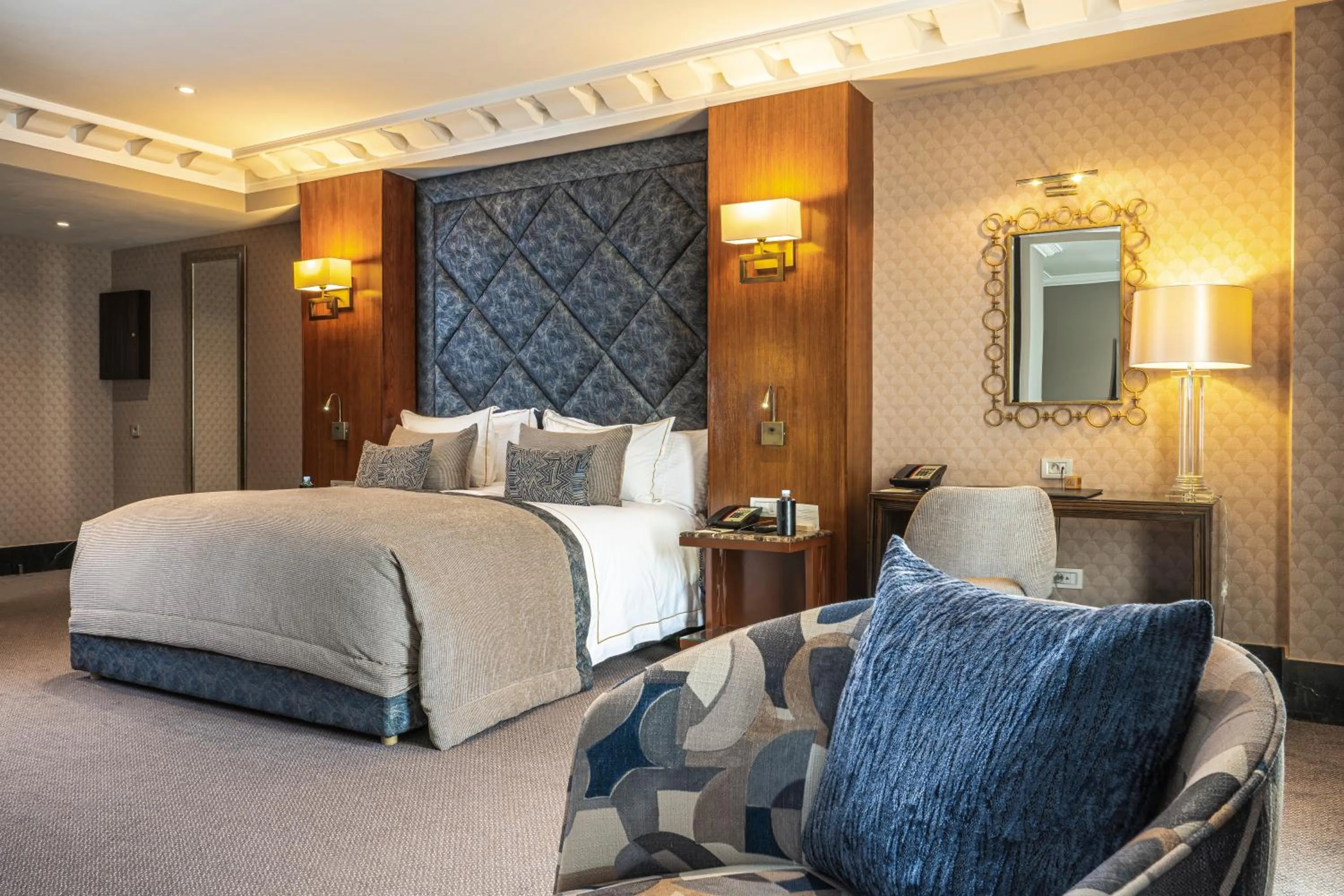 Seating area, Bed in Le Casablanca Hotel