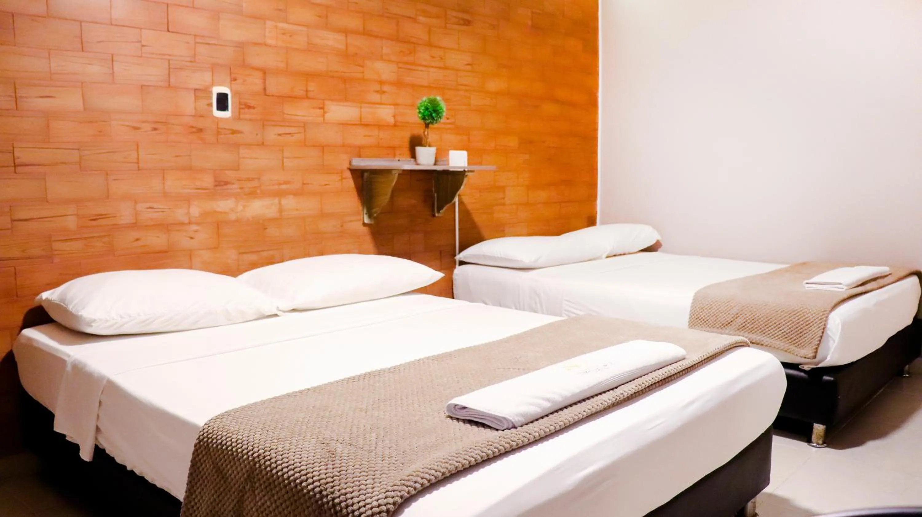 Bed in Hotel Simón Plaza