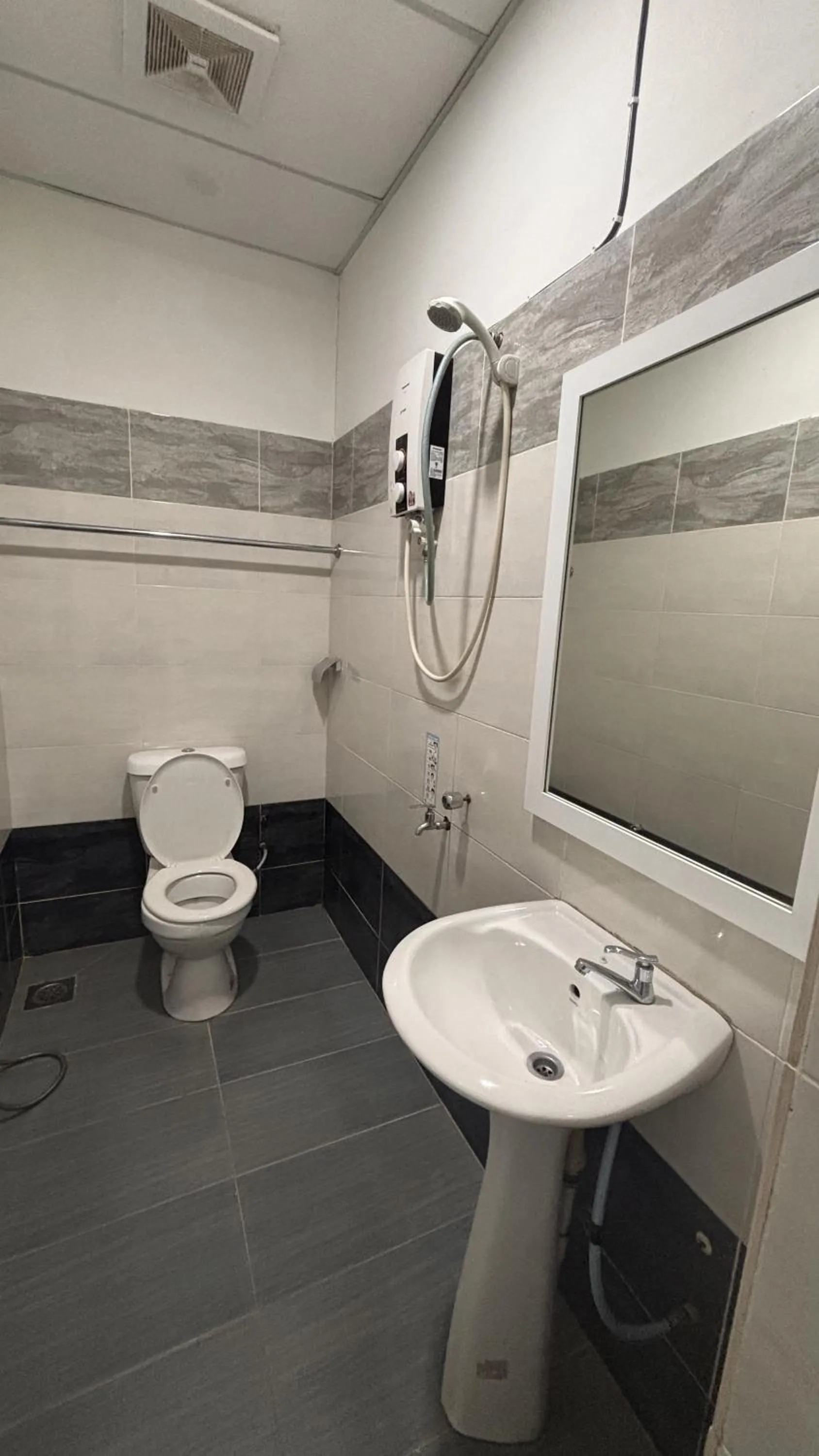 Toilet in Ada Hotel & Apartment