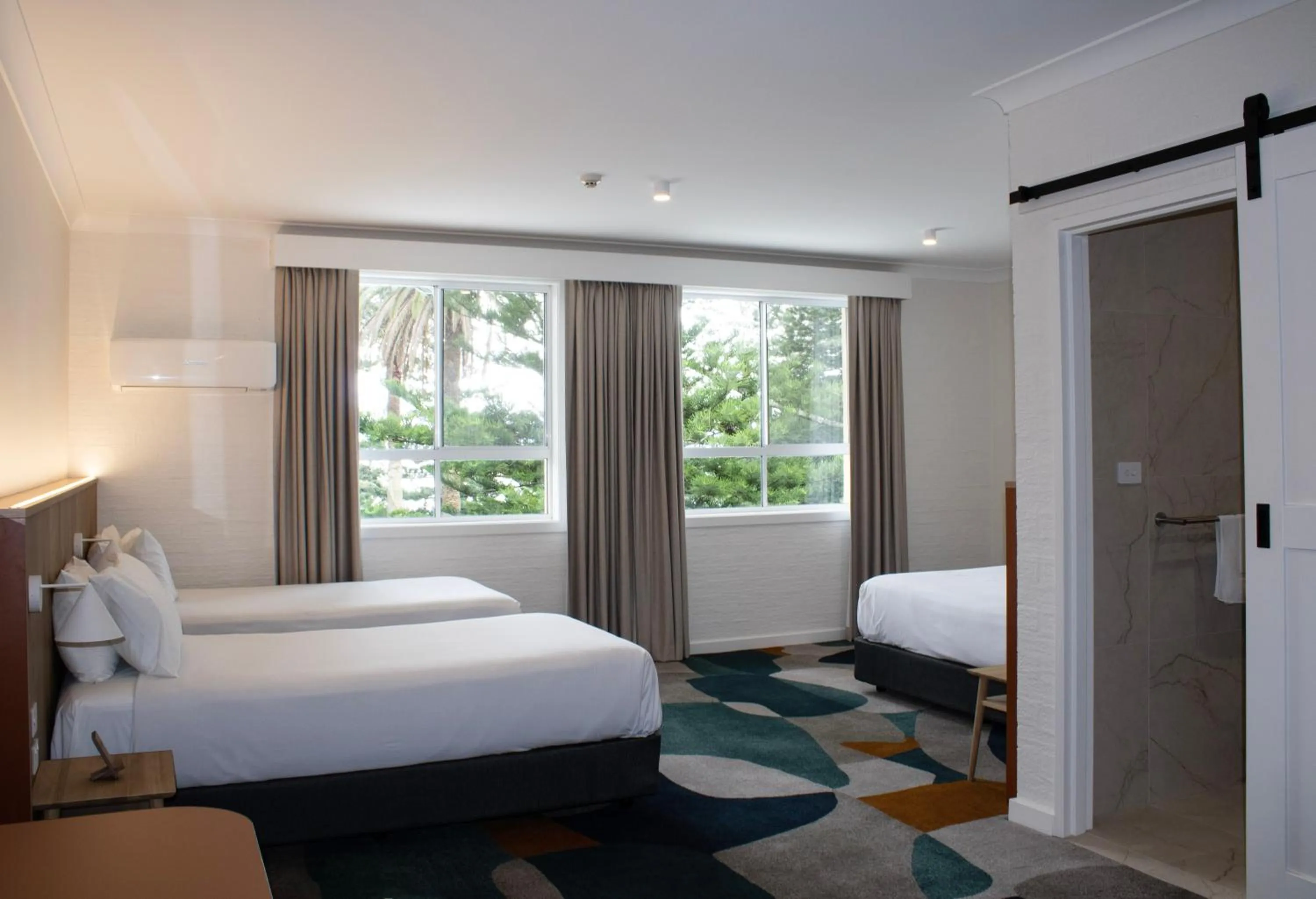 Bed in Seabreeze Beach Hotel