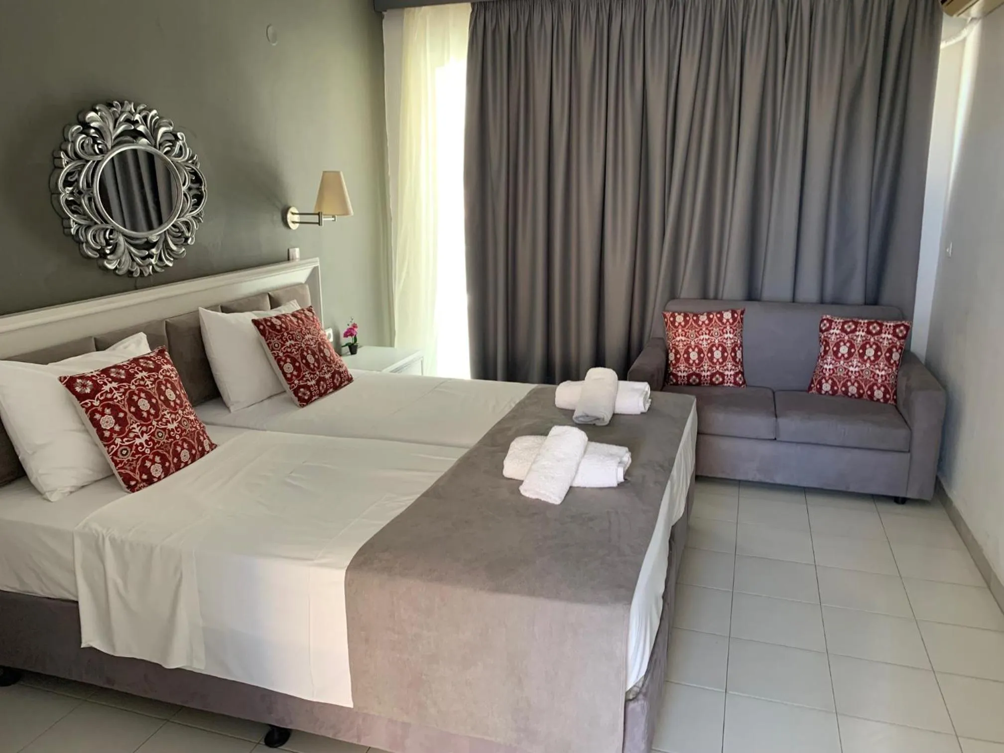 Bed in Alkyonides Boutique Hotel