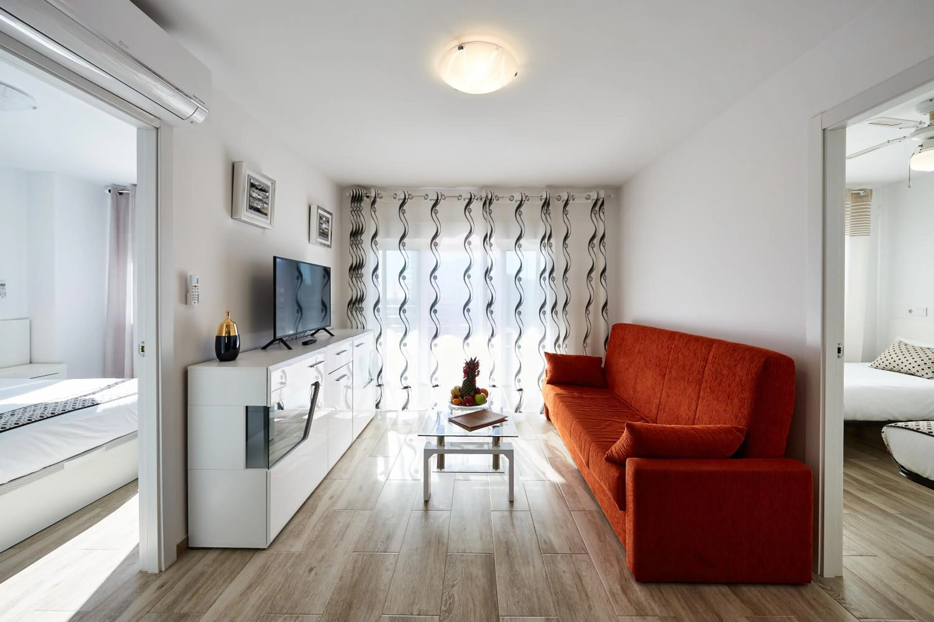 Living room, Bed in Sonrisa Apartments