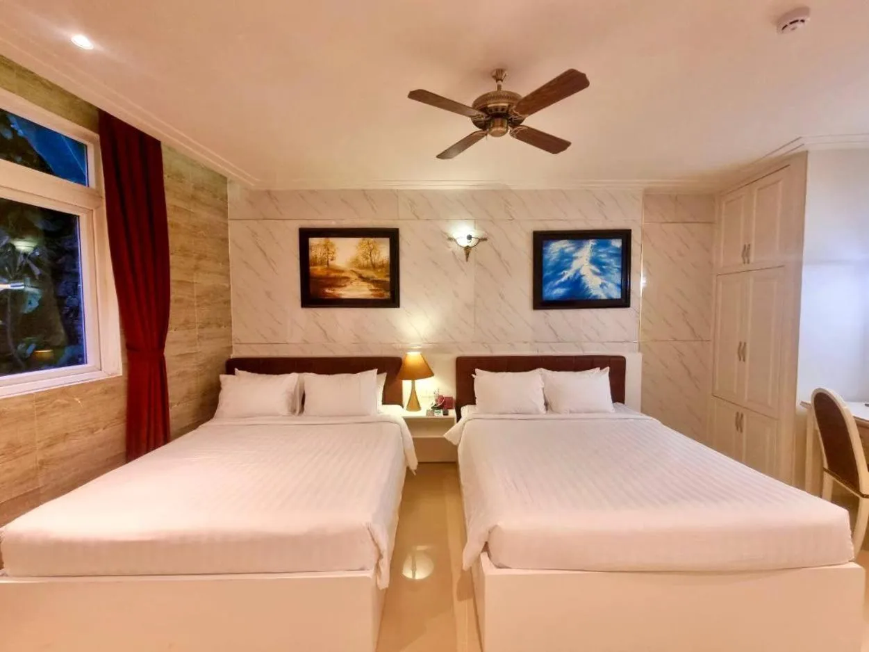 Bed in Tulip Hotel 3