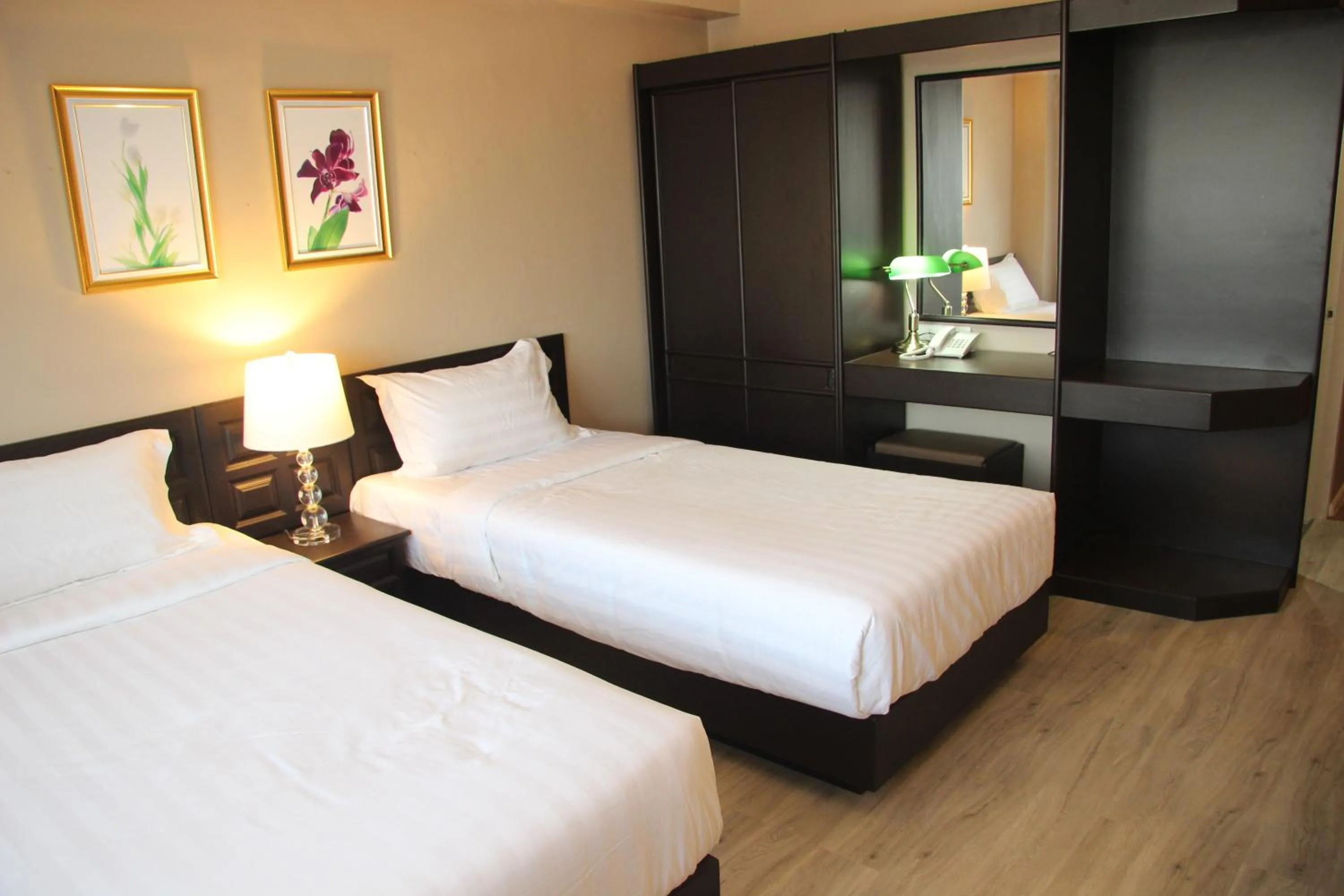 Bed in Taris Art Hotel Phrae