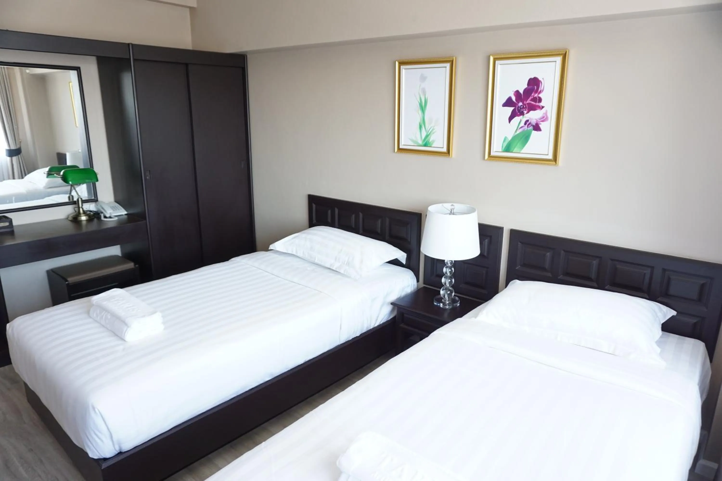 Bed in Taris Art Hotel Phrae
