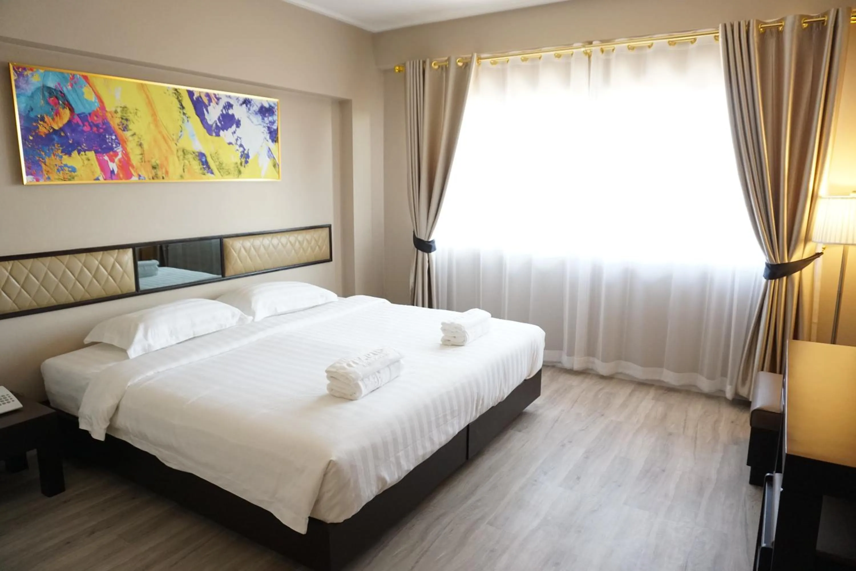 Bed in Taris Art Hotel Phrae