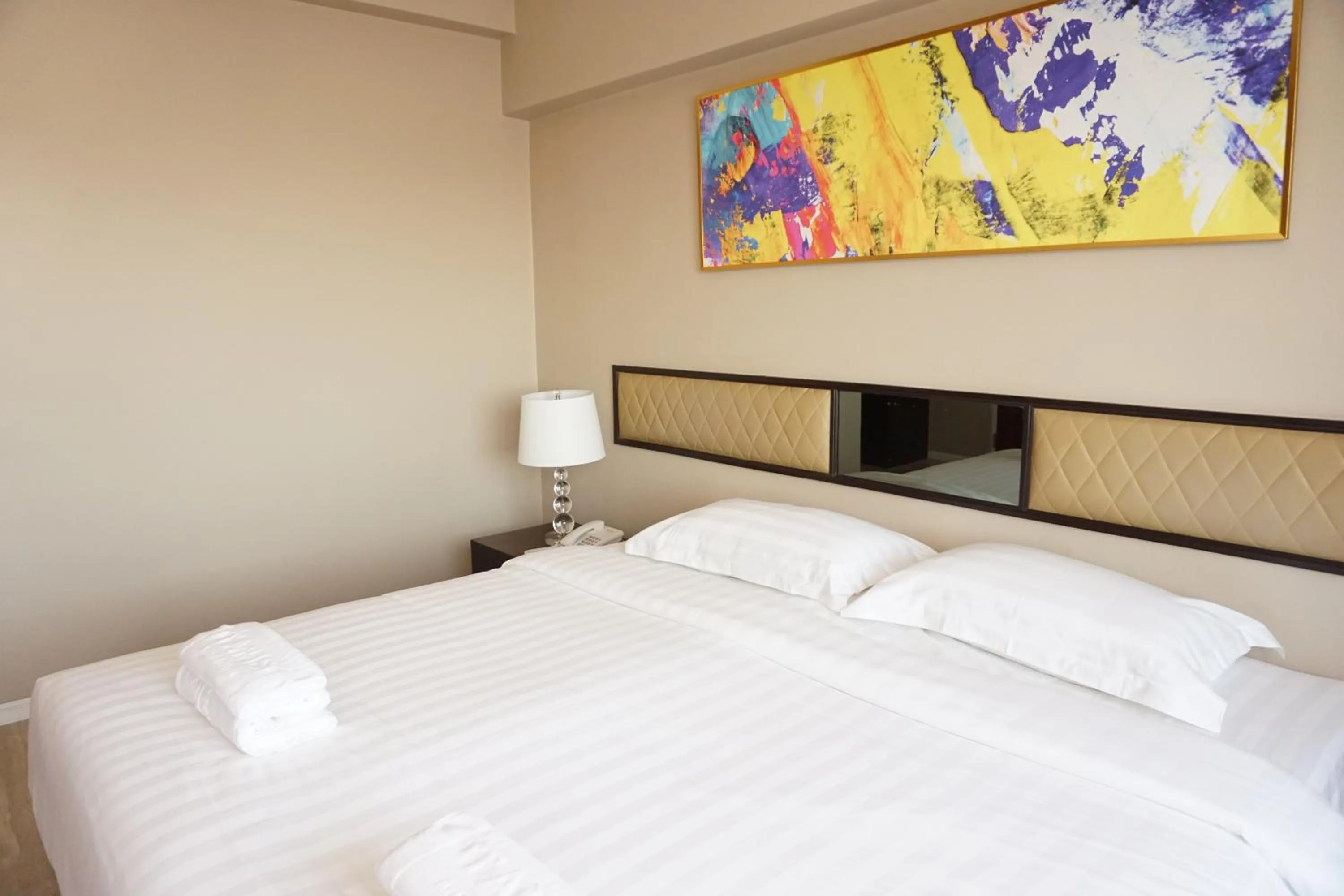 Bed in Taris Art Hotel Phrae