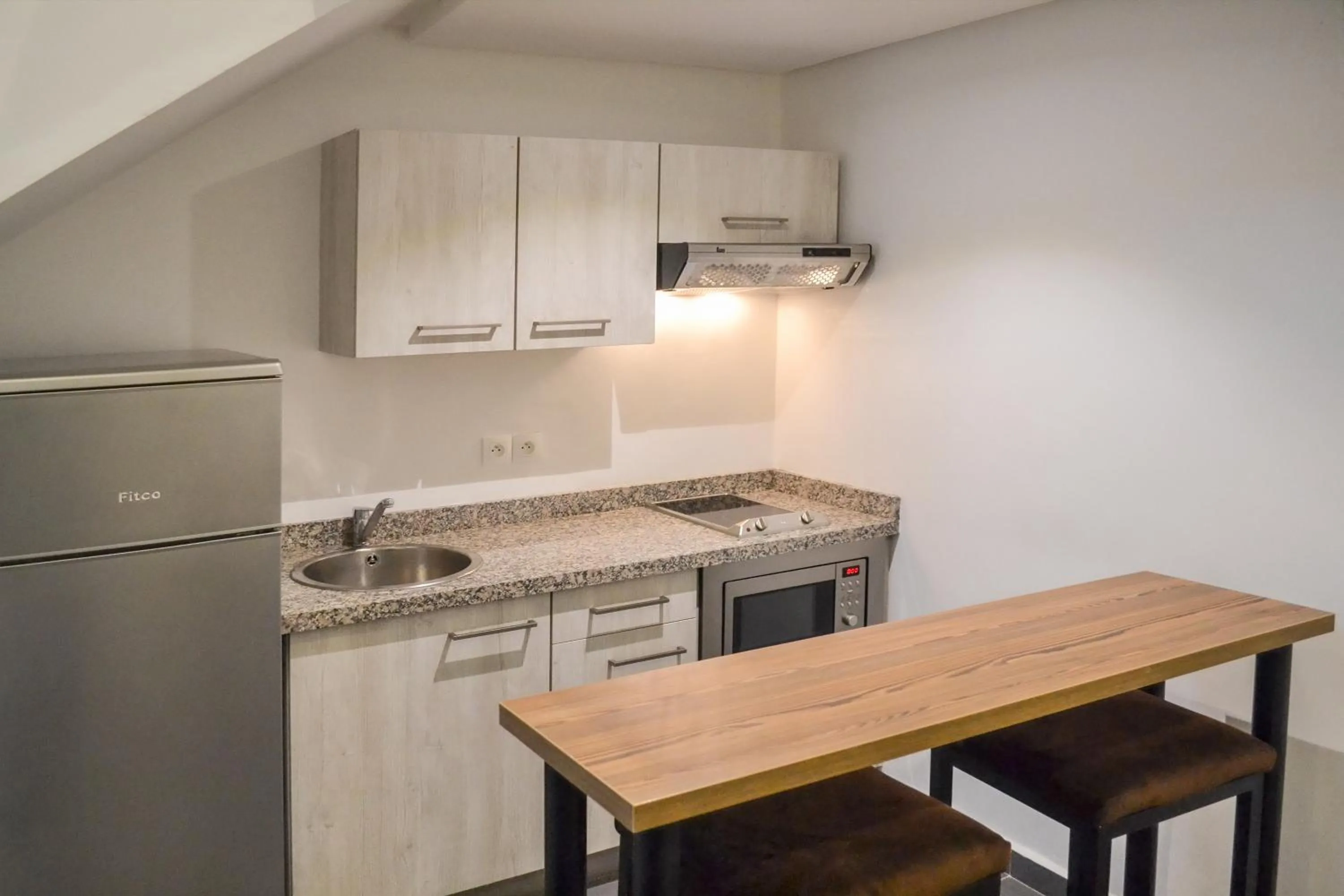 Kitchen or kitchenette in Wazo Appart-Hôtel