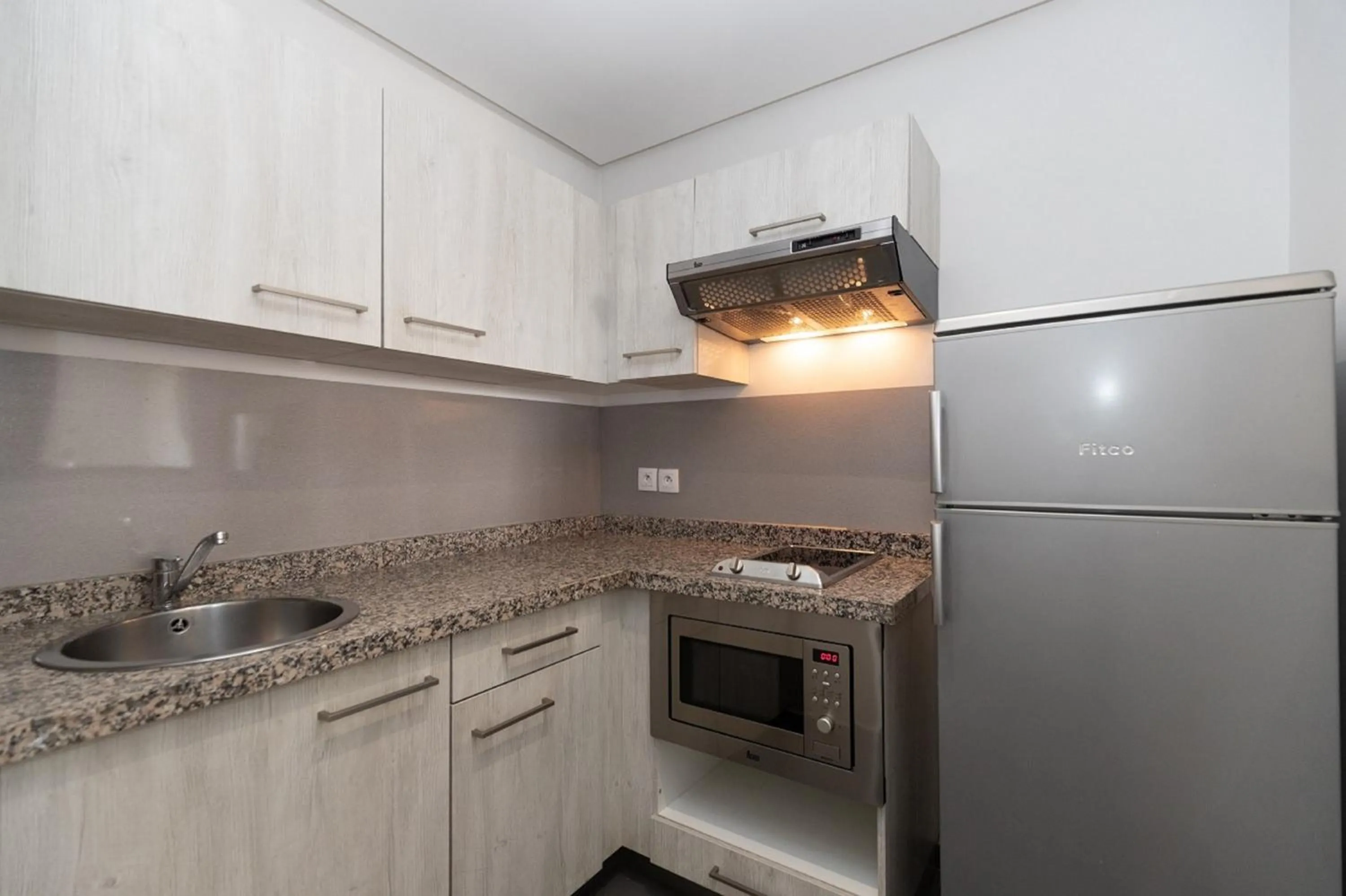 Kitchen or kitchenette in Wazo Appart-Hôtel