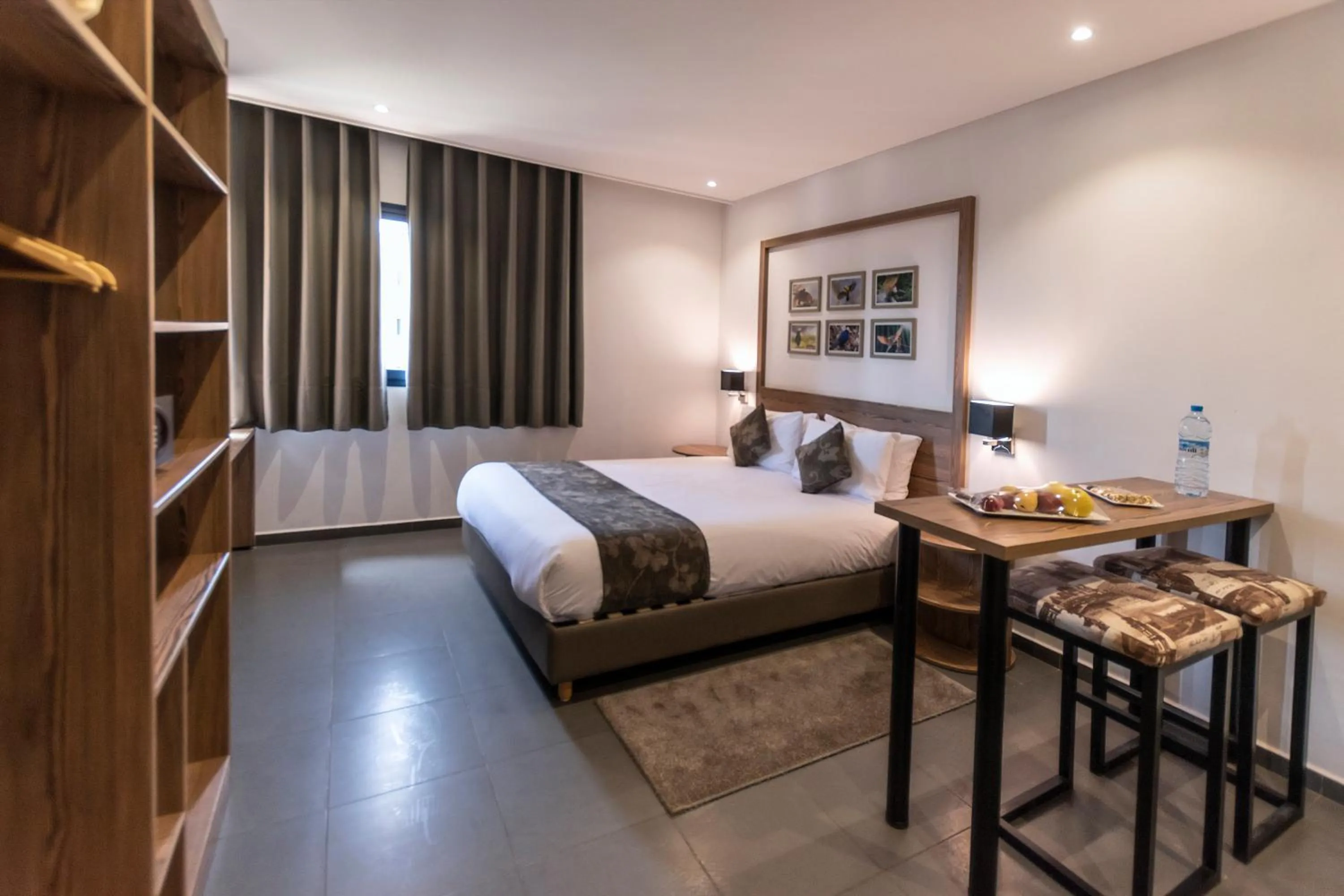 Photo of the whole room, Bed in Wazo Appart-Hôtel