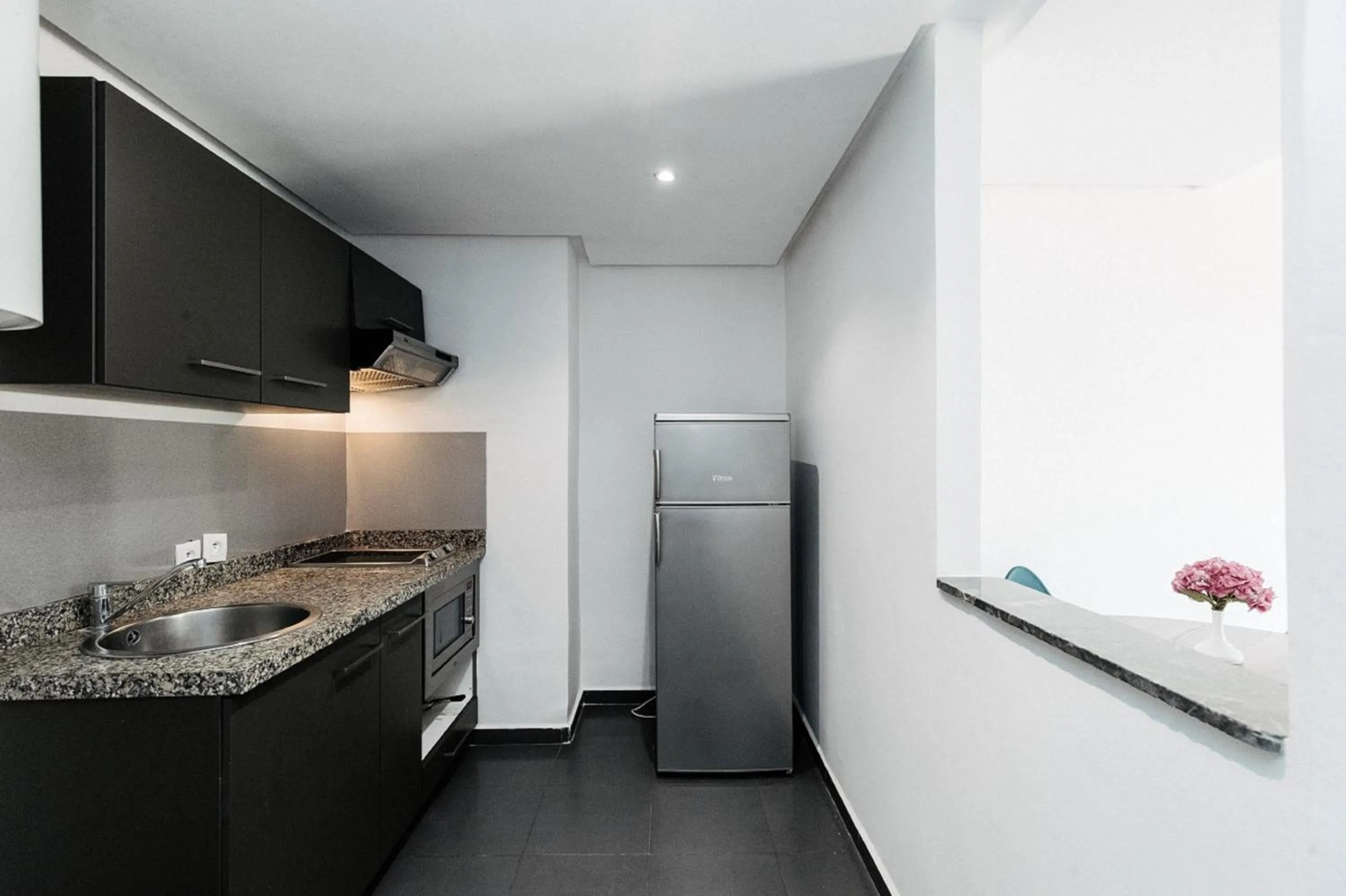 Kitchen or kitchenette in Wazo Appart-Hôtel