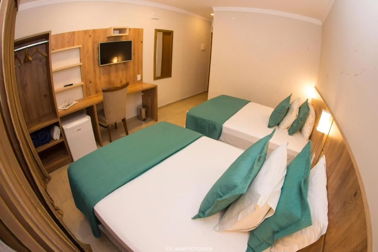 Bed in Pousada Villarejo Armação