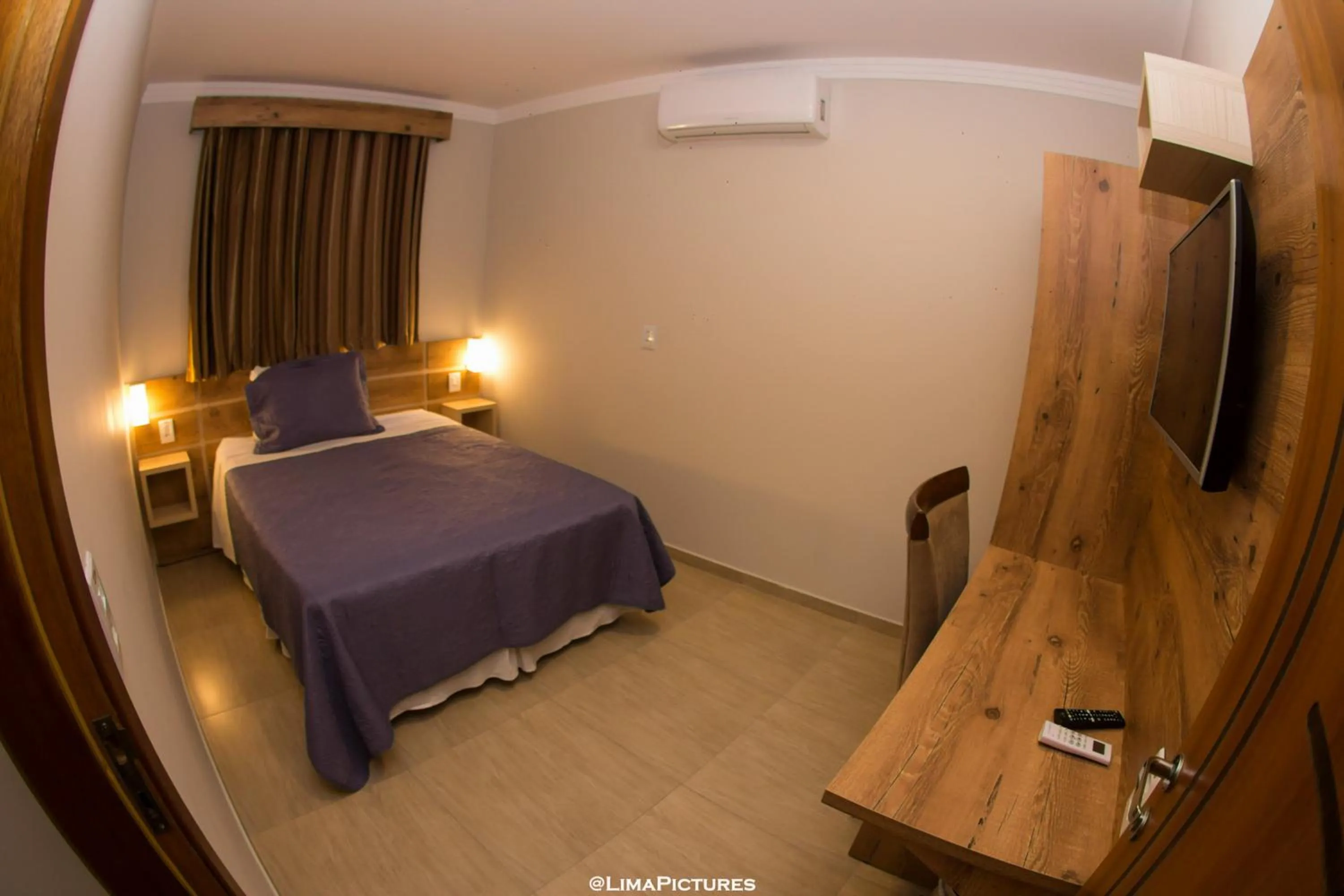 Bed in Pousada Villarejo Armação