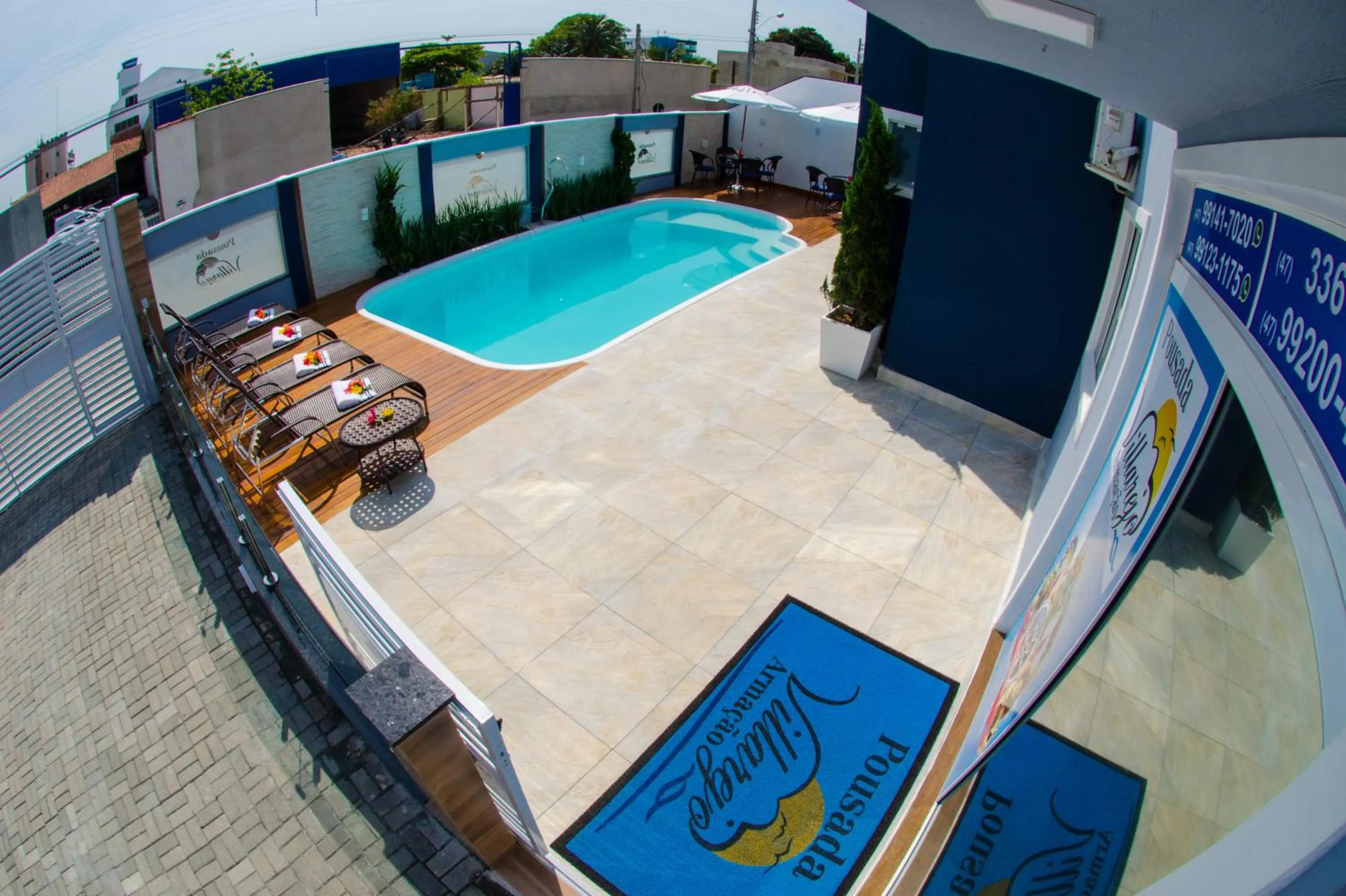 Swimming pool in Pousada Villarejo Armação