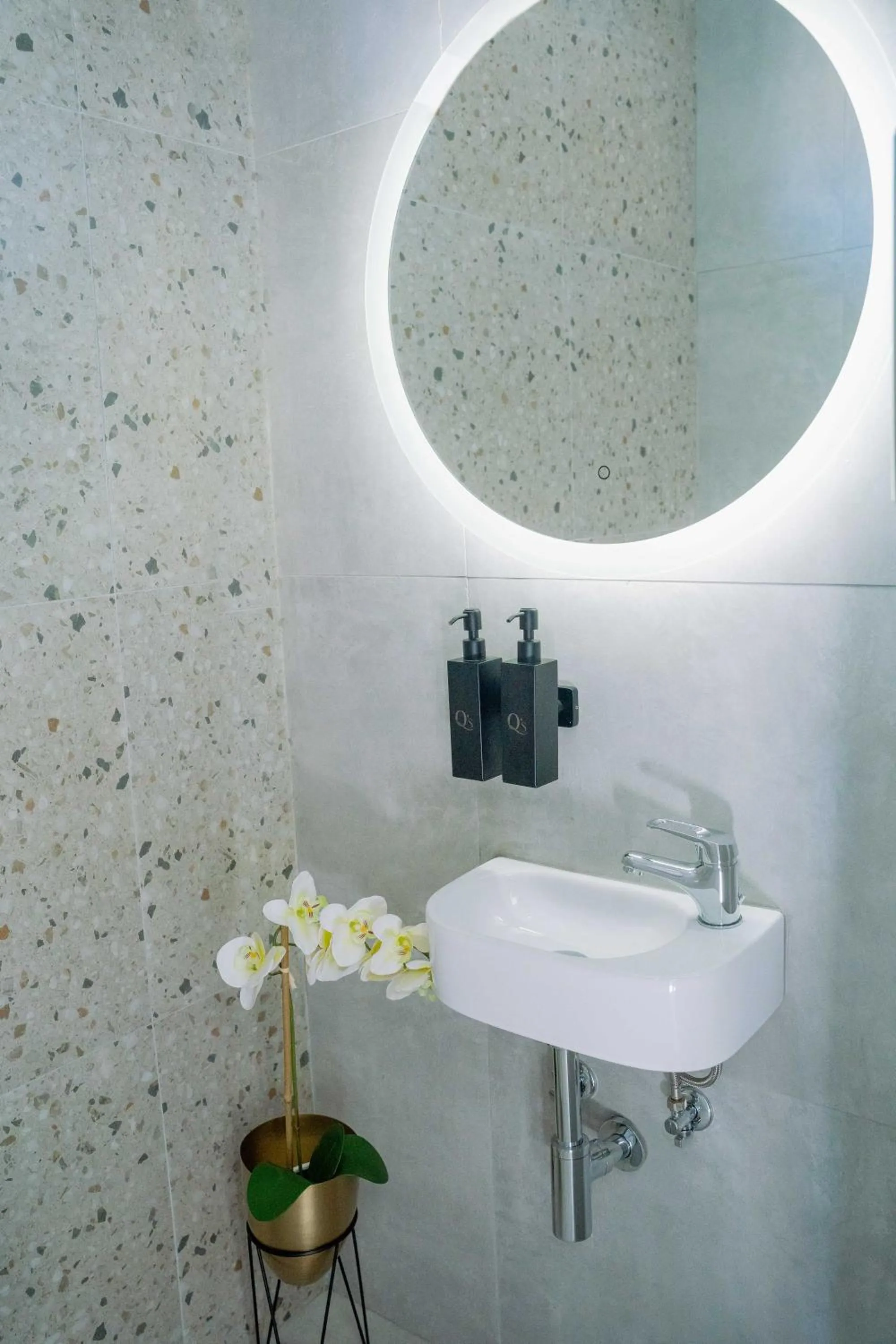 Bathroom in Q's Boutique Stay