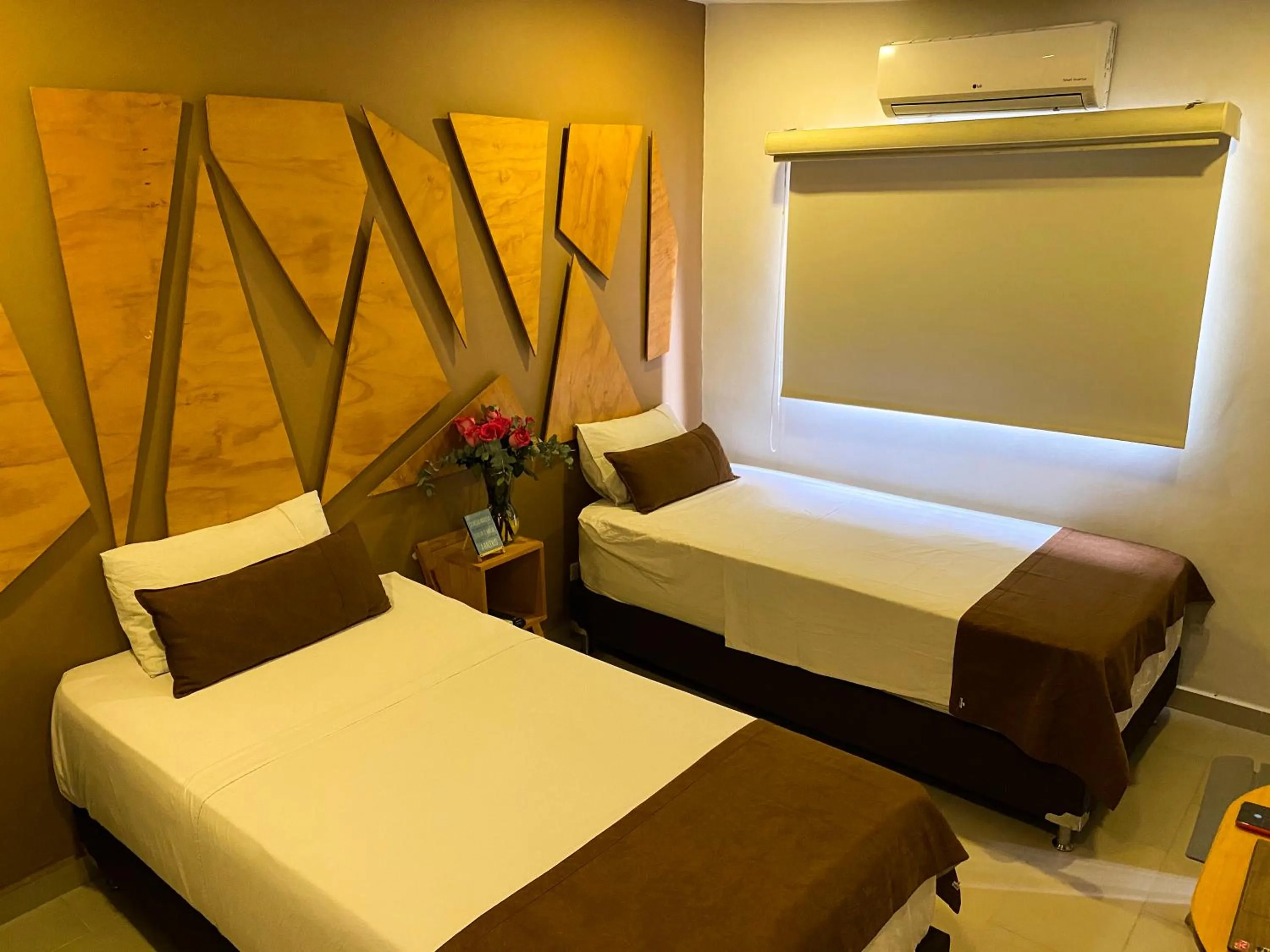 Bed in Rivière Boutique Hotel