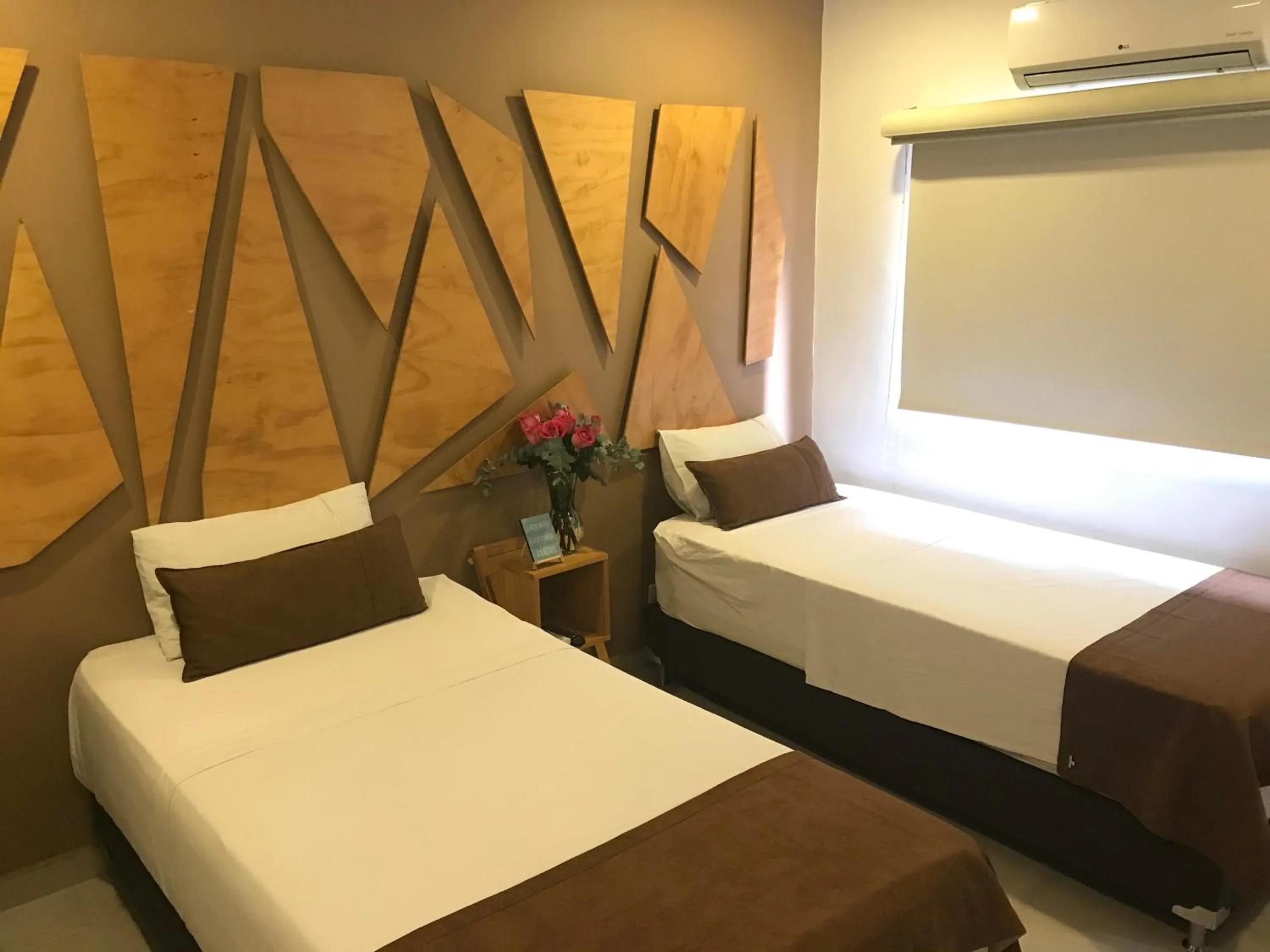 Bed in Rivière Boutique Hotel