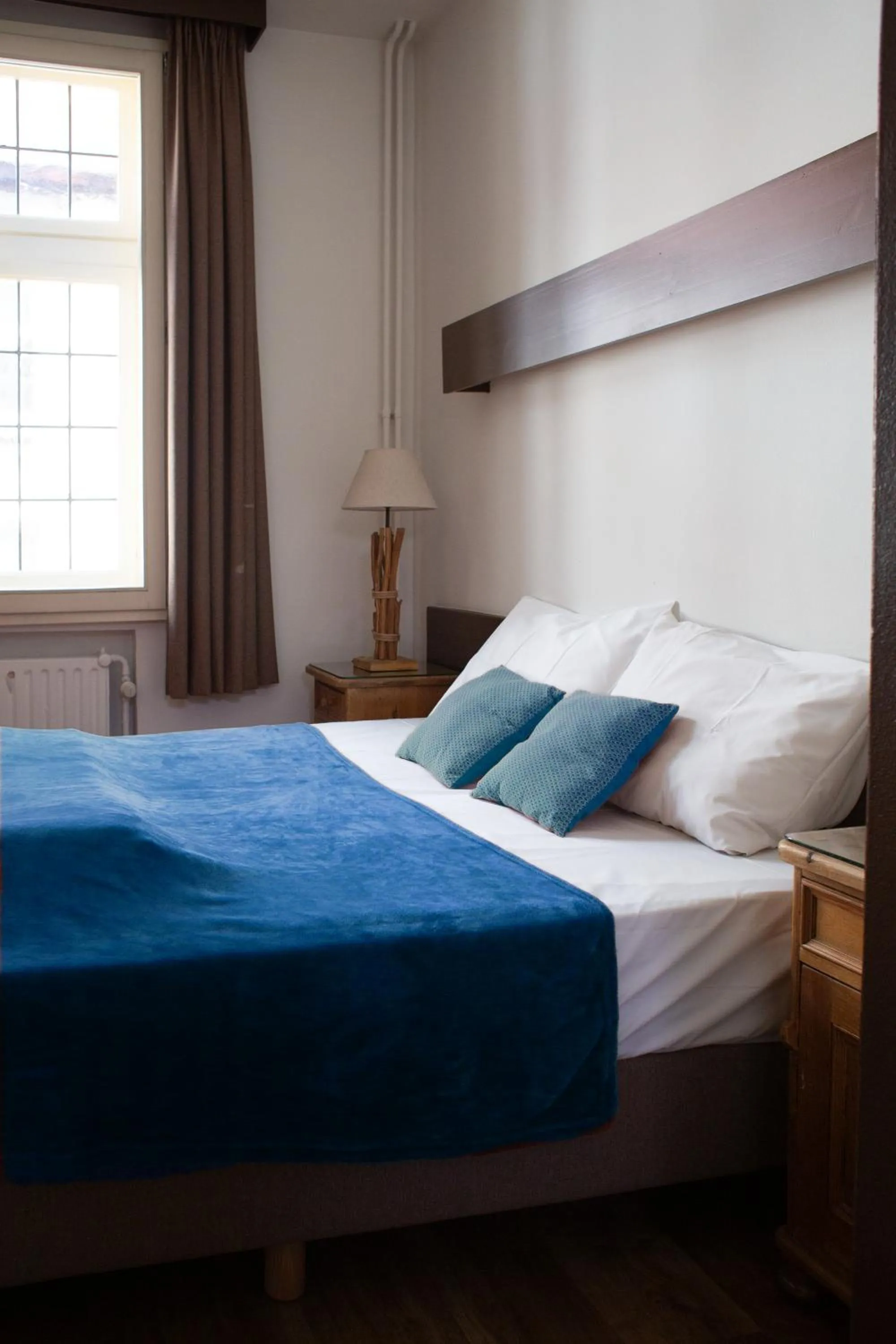 Bed in Hotel La Vieille Lanterne