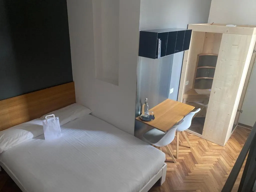 Bed in Lainez Rooms & Suites