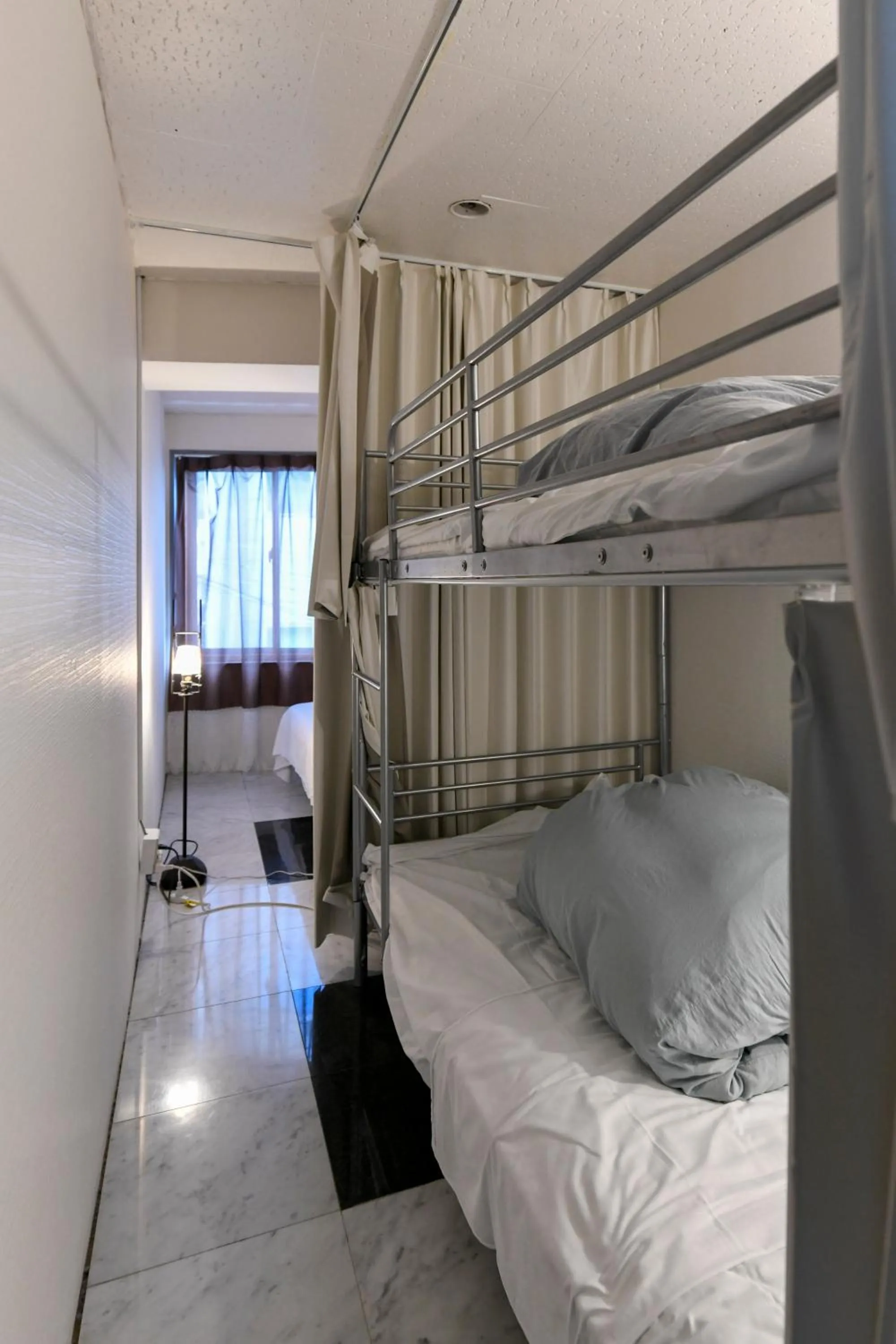 Bed in Guest House M104 Kagoshima