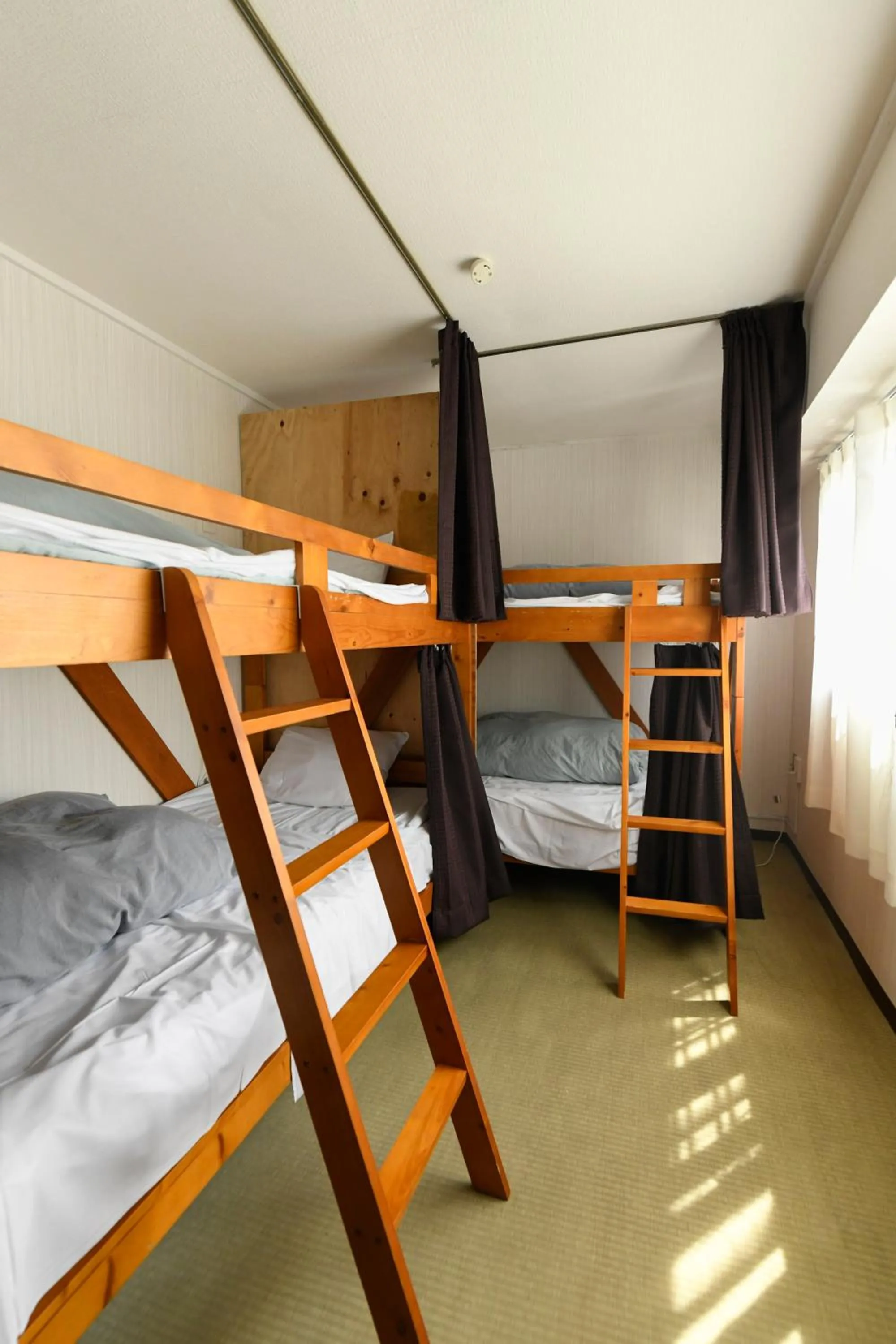 Bed in Guest House M104 Kagoshima