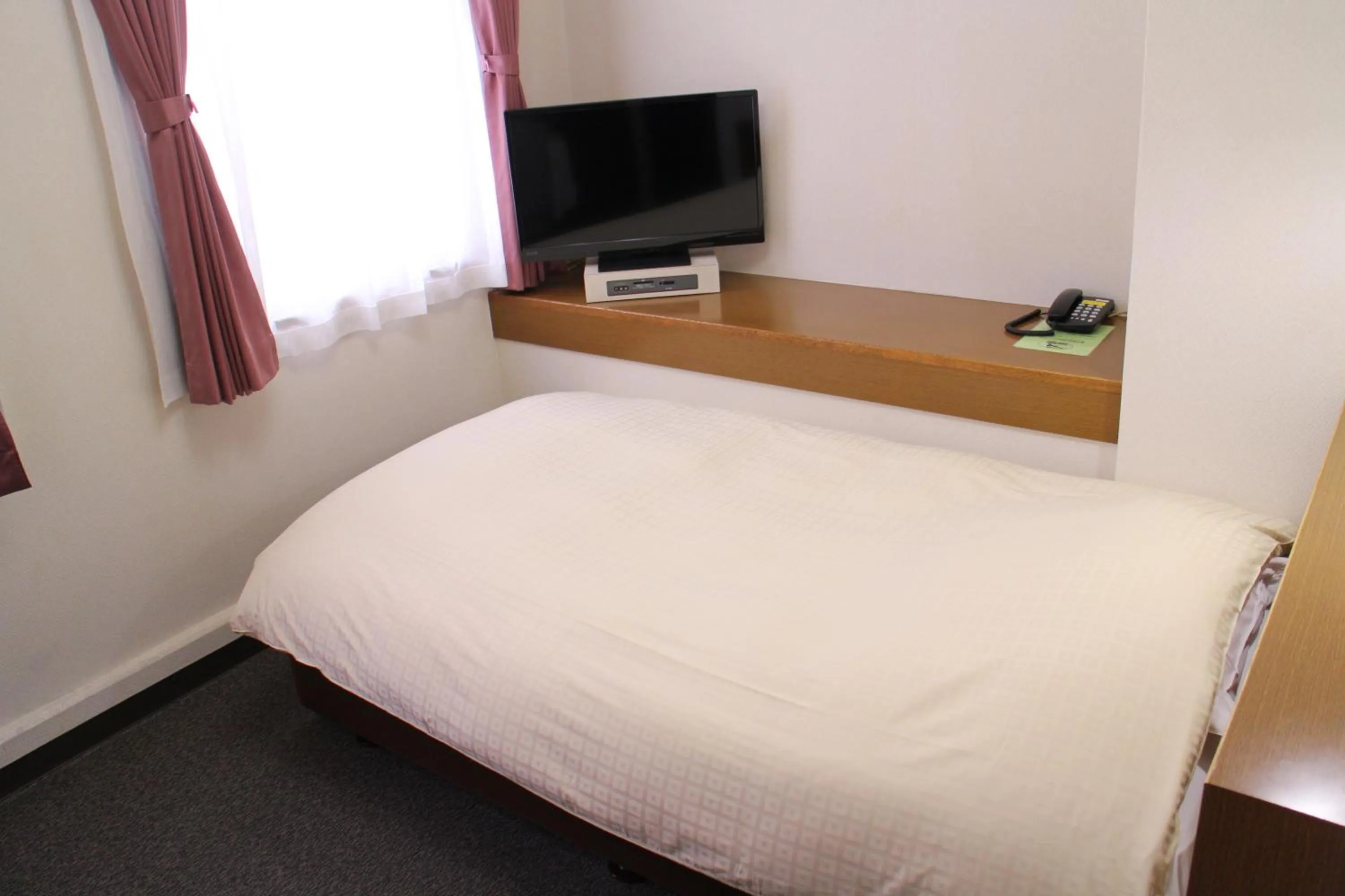 Photo of the whole room, Bed in Business Hotel Raicho